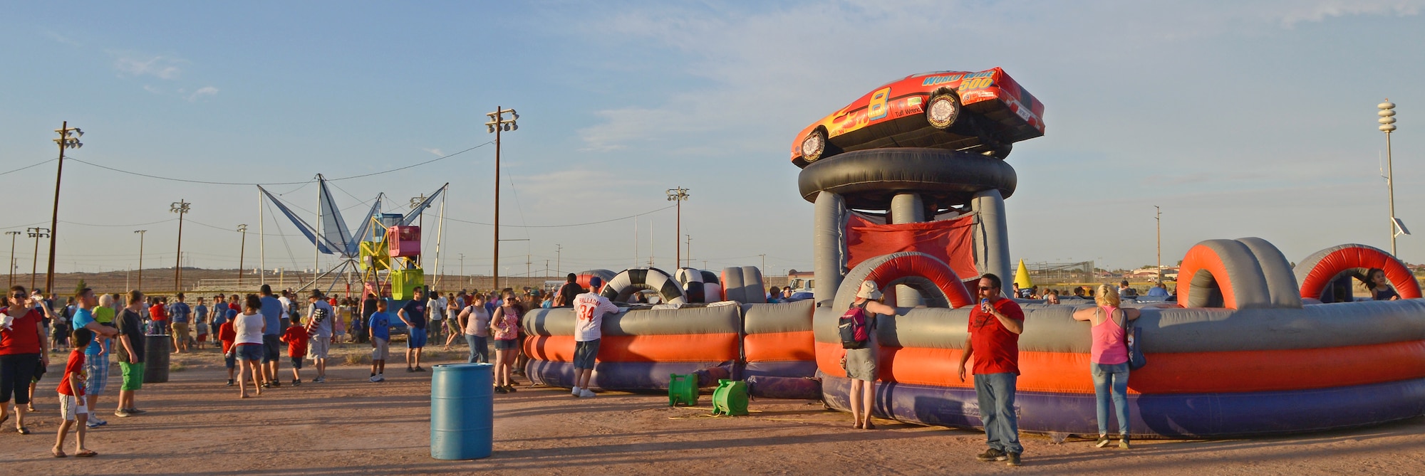 An inflatable obstacle course and a jumping harness were just two of the many rides that were available for those in attendance during the 2014 Freedom Fest at Roberts Field on July 4. (U.S. Air Force photo by Jet Fabara)