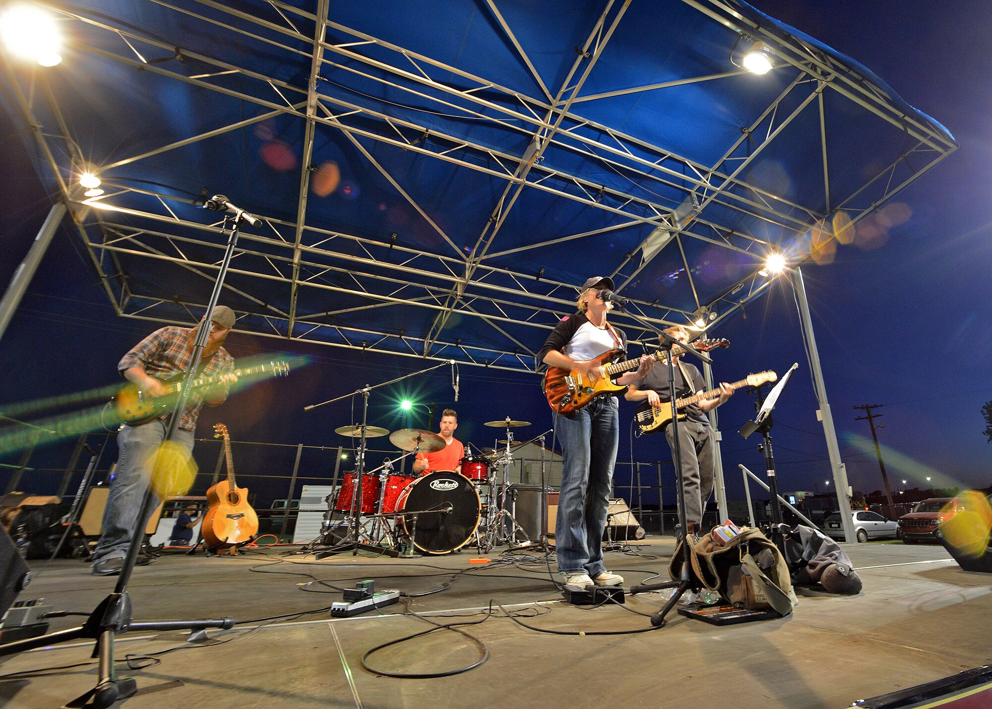 Jennifer Housholder (center) of Hous Band provided live entertainment for the base community prior to the presentation of colors, the national anthem and fireworks demonstration during the 2014 Freedom Fest on July 4 at Wings and Roberts Fields. (U.S. Air Force photo by Jet Fabara)