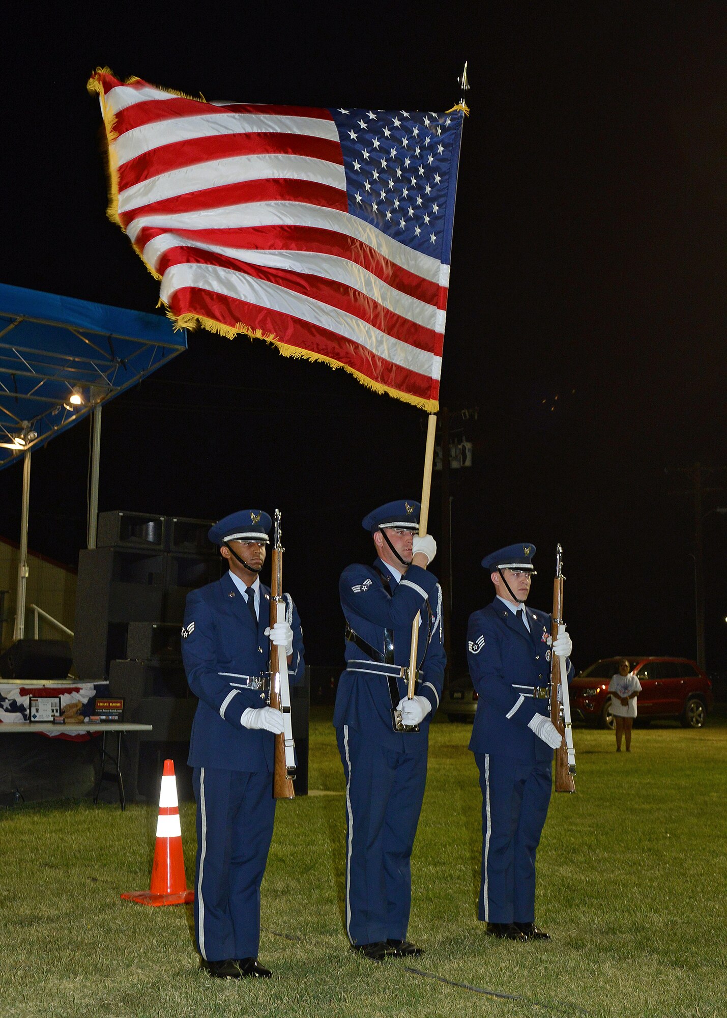 The Edwards Blue Eagles Honor Guard present the colors during the 2014 Freedom Fest on July 4 at Wings Field. (U.S. Air Force photo by Jet Fabara)