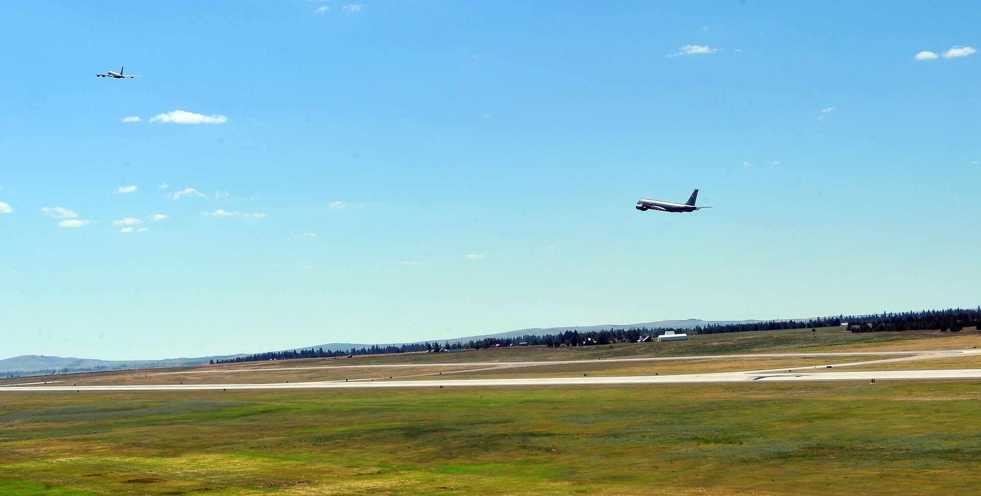 Members from the 509th Weapons Squadron take off the runway in KC-135 Stratotankers to execute minimum interval takeoff procedures for the first time in twenty years reduced July 8, 2014 at Fairchild Air Force Base, Wash.  The 509th WPS mission is to provide the world's most advanced training in weapons and tactics employment to officers of the Air Force. (U.S. Air Force photo by Staff Sgt. Veronica Montes/Released)