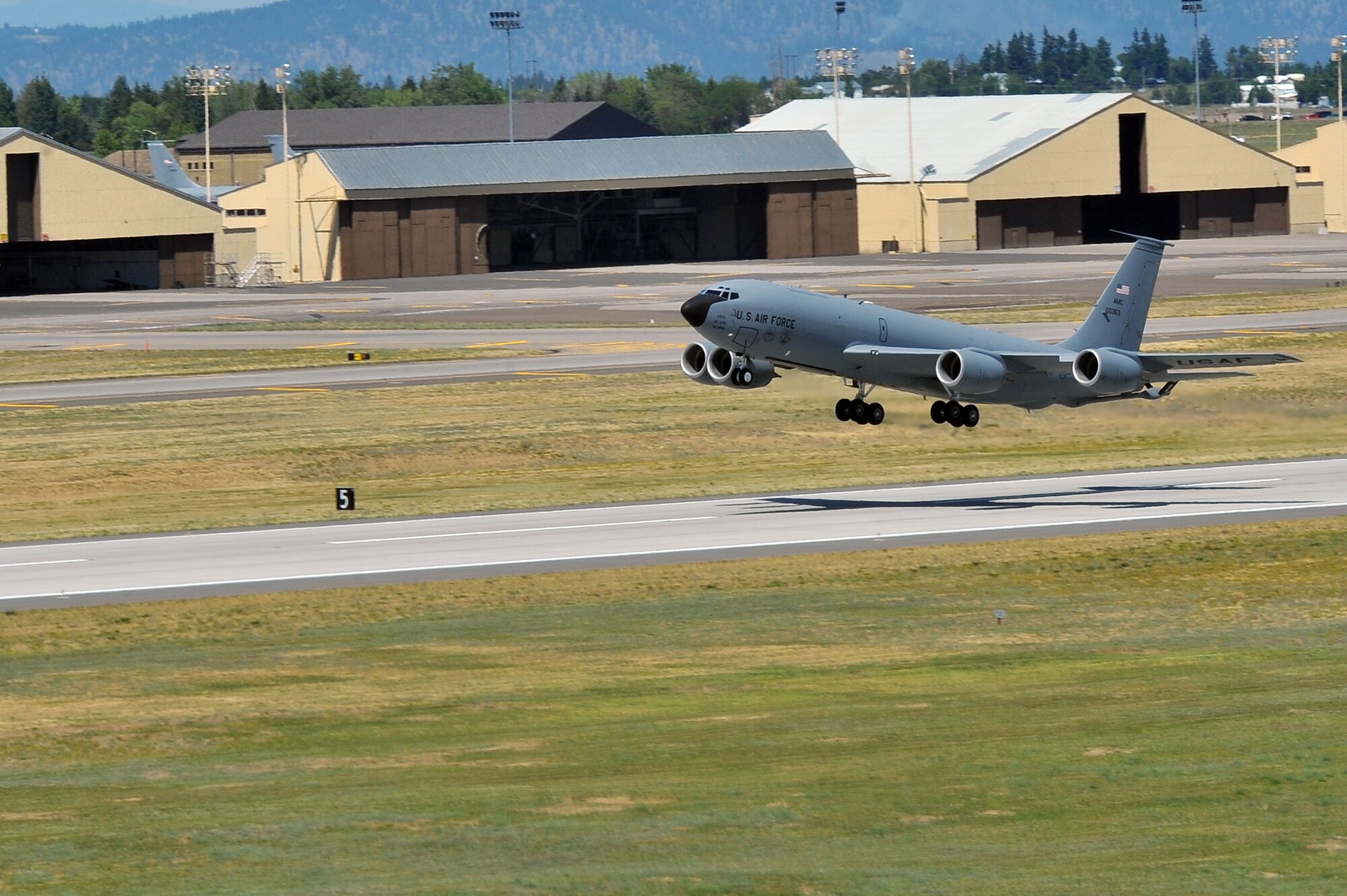 Members from the 509th Weapons Squadron take off the runway in a KC-135 Stratotanker to execute minimum interval takeoff procedures for the first time in twenty years reduced July 8, 2014 at Fairchild Air Force Base, Wash.  The 509th WPS mission is to provide the world's most advanced training in weapons and tactics employment to officers of the Air Force. (U.S. Air Force photo by Staff Sgt. Veronica Montes/Released) 