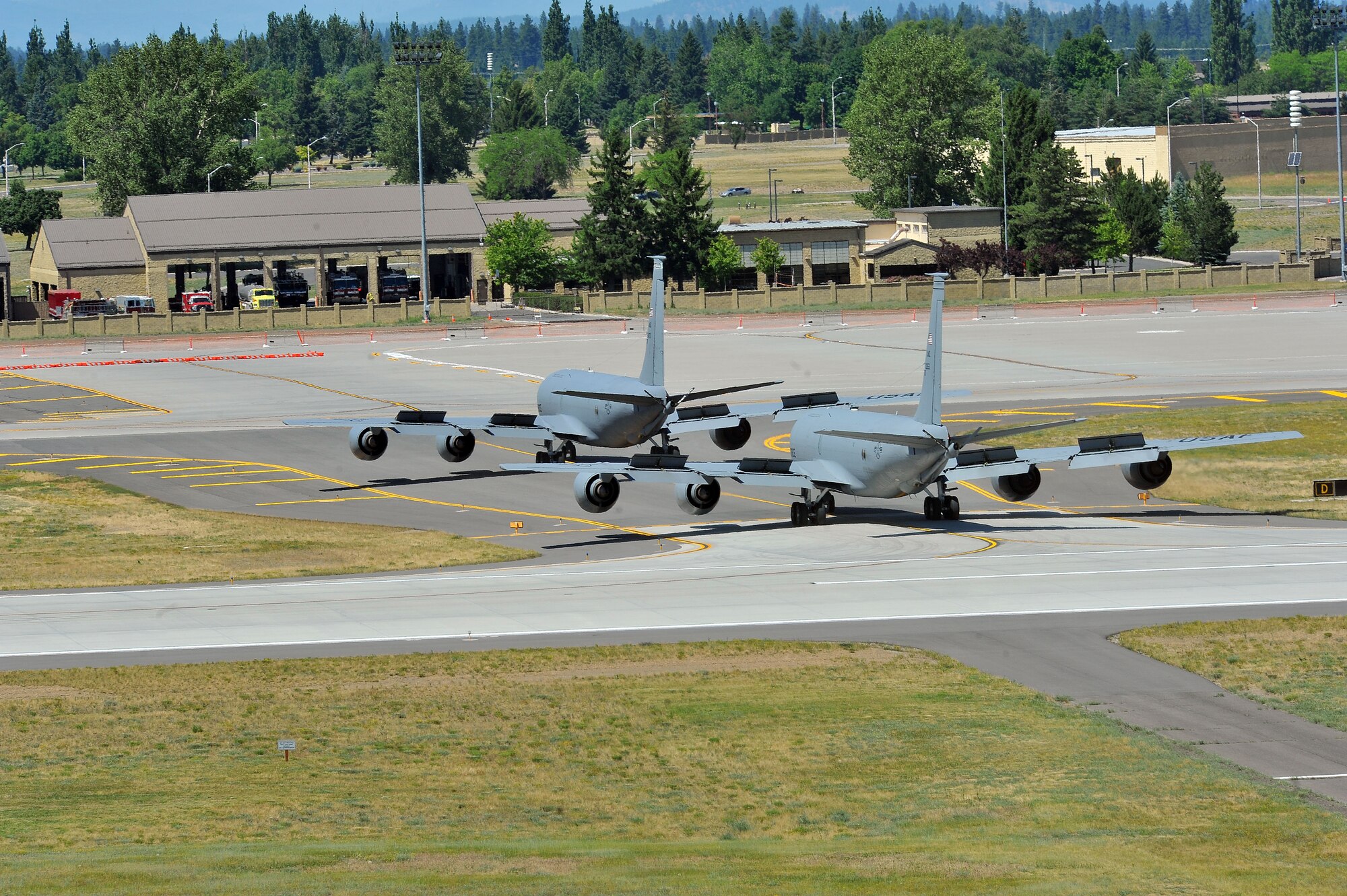 Members from the 509th Weapons Squadron taxi along the runway on KC-135 Stratotankers to execute minimum interval takeoff procedures for the first time in twenty years reduced July 8, 2014 at Fairchild Air Force Base, Wash.  The 509th WPS mission is to provide the world's most advanced training in weapons and tactics employment to officers of the Air Force. (U.S. Air Force photo by Staff Sgt. Veronica Montes/Released)