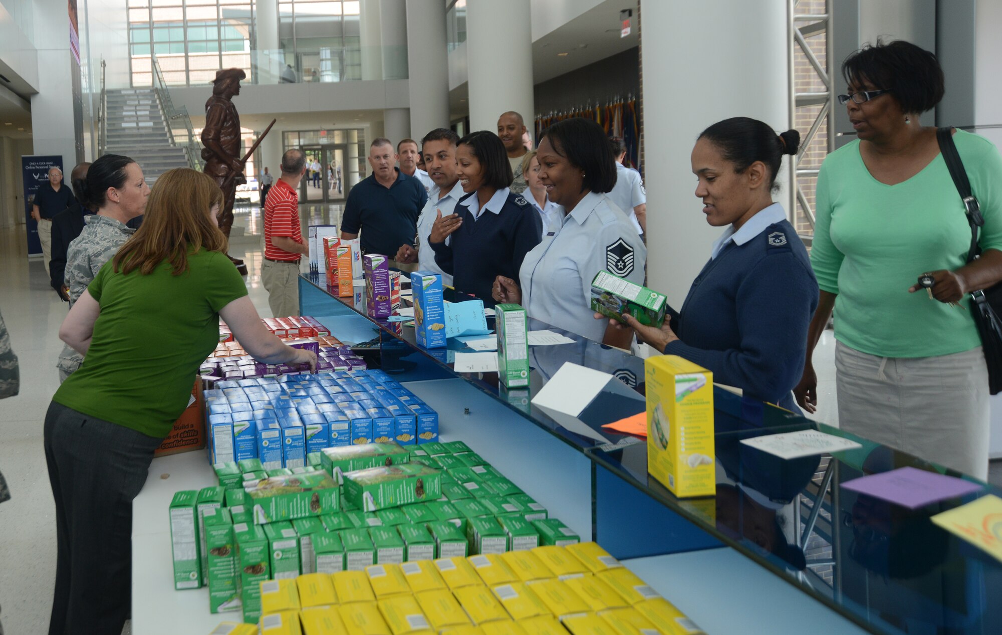 The men and women of the Air National Guard Readiness Center on Joint Base Anderson, Md., gather to receive donated Girl Scout cookies July 2, 2014. More than 1,500 boxes of cookies were donated to the ANGRC by Girl Scouts from the Hudson River valley, N.Y. (U.S. Air National Guard photo by Senior Airman John E. Hillier/Released)