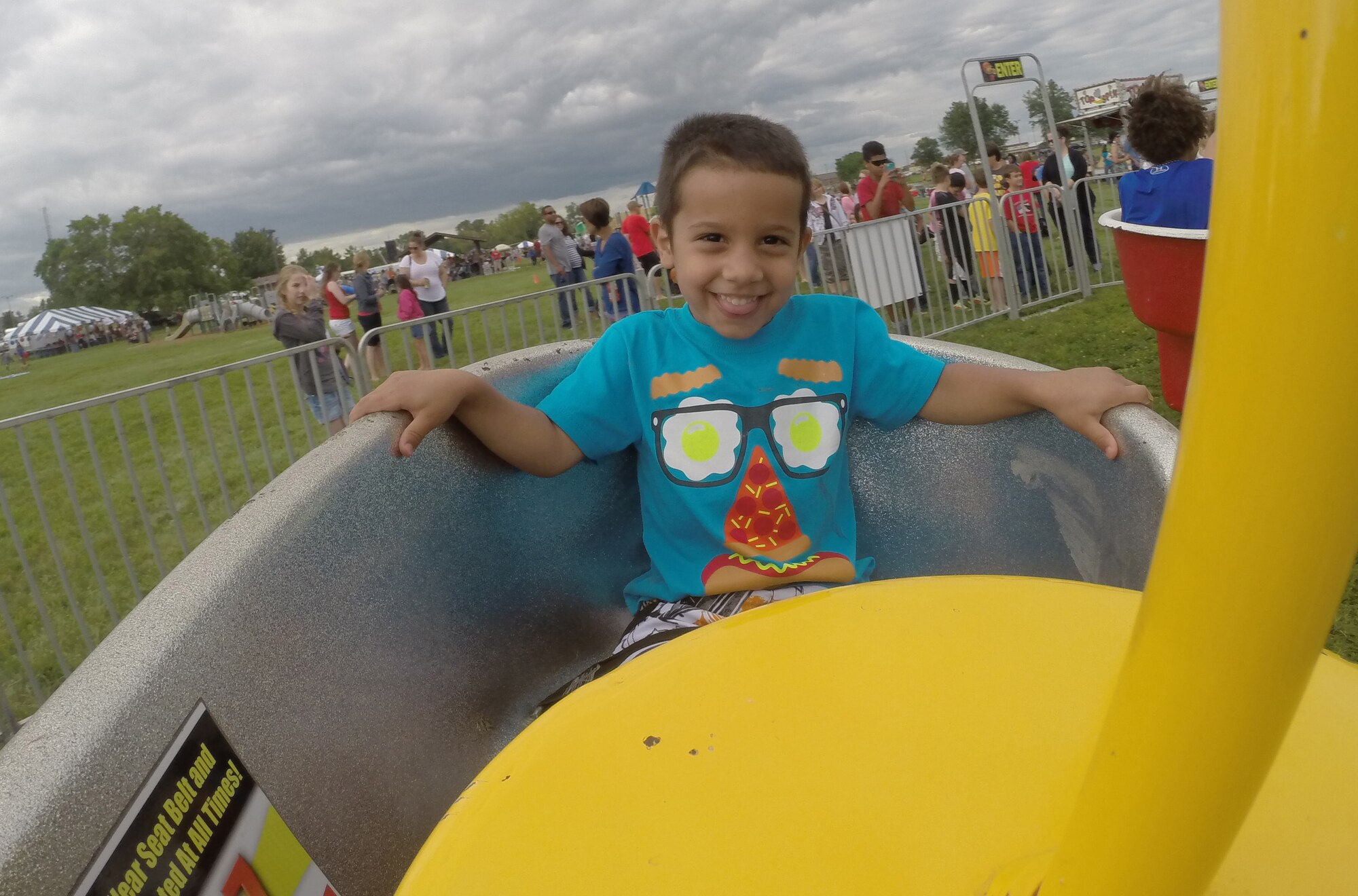 Mikey, 3, rides on the Mind Winder Swings during the Independence Day Celebration at Whiteman Air Force Base, Mo., July 2, 2014. There was free face painting, a water slide, feeding and petting zoo, live music, bingo, zip line and a video game tent. Mikey is the son of Staff Sgt. Michael Boutte, 509th Security Forces Squadron combat arms instructor. (Courtesy Photo)
