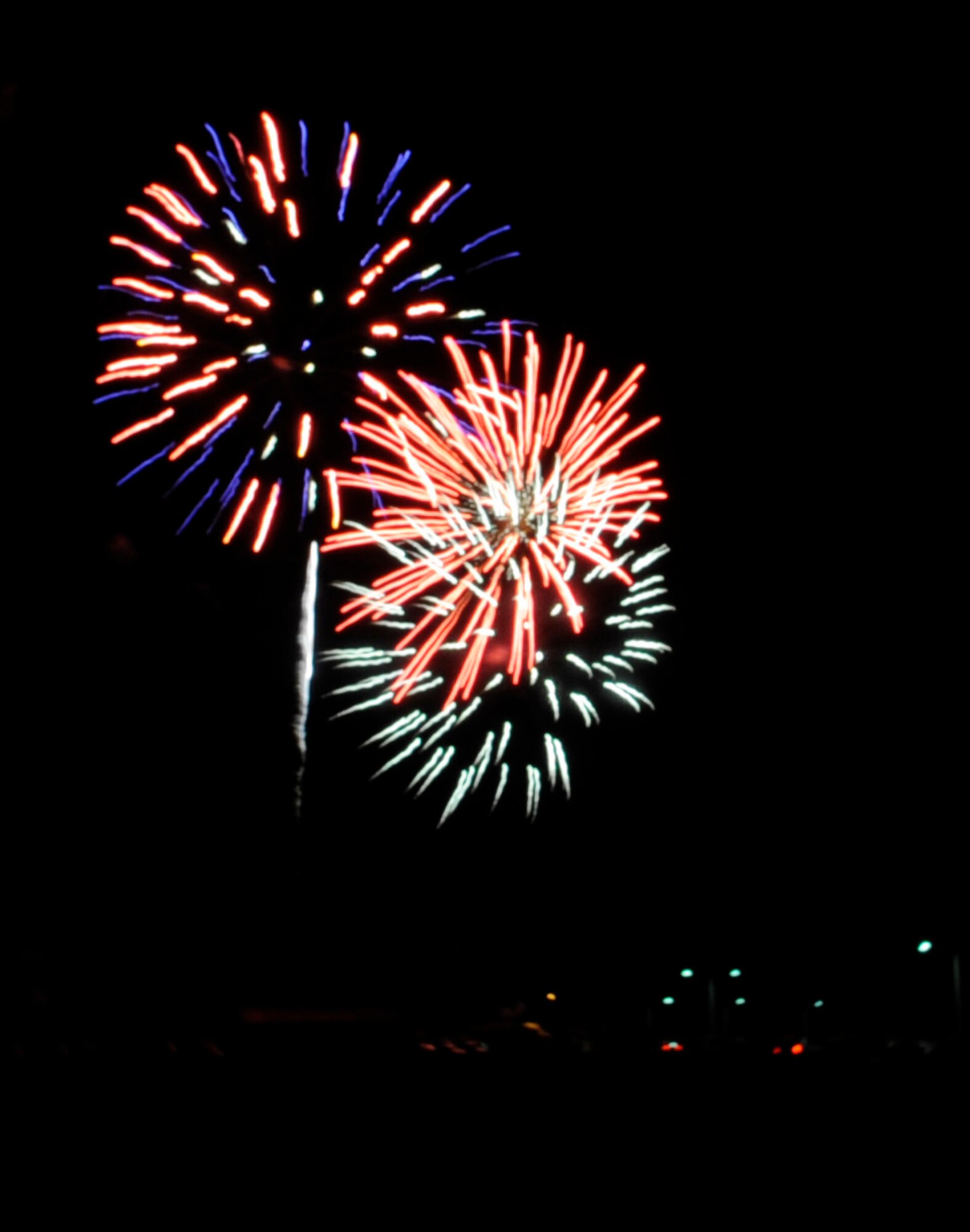 Whiteman Airman and families were able to watch a series of fireworks at night after the Independence Day Celebration, July 2, 2014. People could listen to live music, play bingo, ride carnival attractions and feed animals at the petting zoo. There was free face painting and a water slide. (U.S. Air Force photo by Staff Sgt. Alexandra M. Boutte/Released)