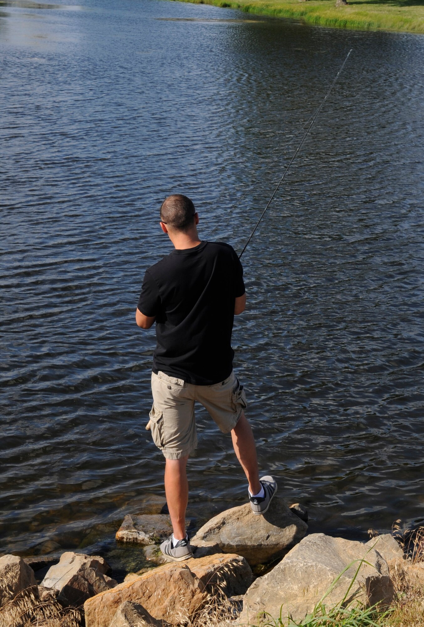 During the Independence Celebration at Whiteman Air Force Base, Mo., July 2, 2014, Airman and their families could participate in a fishing derby. There were prizes for the top three biggest and smallest fish caught in the Ike Skelton Lake. (U.S.  Air Force photo by Staff Sgt. Alexandra M. Boutte/Released)