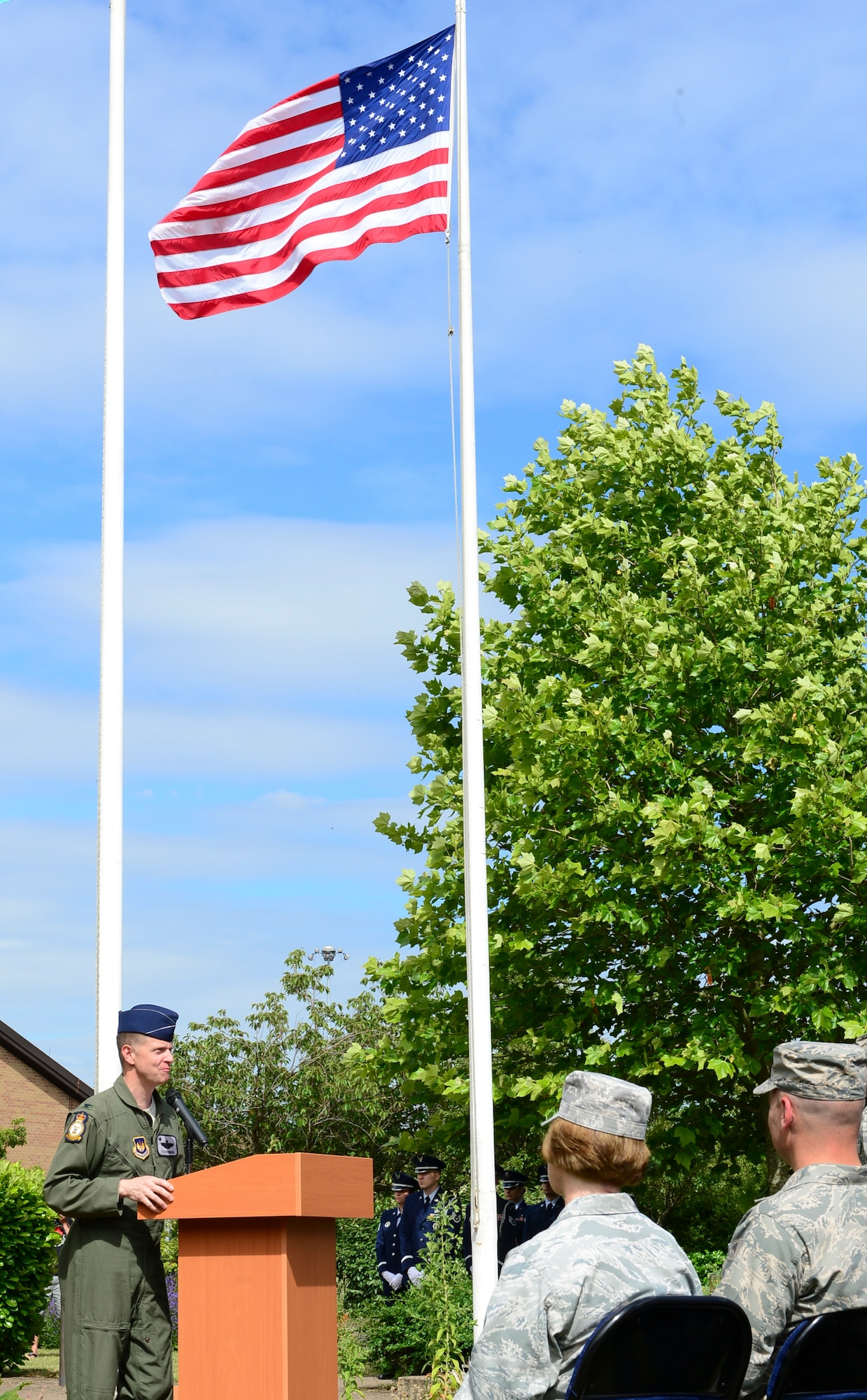 Col. Kyle Robinson, 48th Fighter Wing commander, speaks during a ceremony at Royal Air Force Lakenheath, England, July 3, 2014. Kicking off 4th of July festivities, the 48th Fighter Wing celebrated its 60th anniversary as “The Statue of Liberty Wing.” (U.S. Air Force photo by Airman 1st Class Dawn M. Weber/Released)