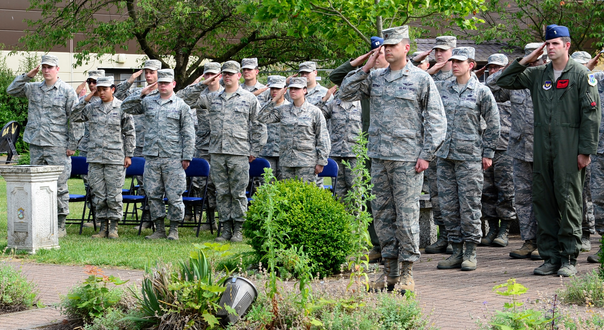 Airmen from the 48th Fighter Wing render a salute during an anniversary ceremony at Royal Air Force Lakenheath, England, July 3, 2014. The 48th Fighter Wing celebrated its 60th anniversary as “The Statue of Liberty Wing.” (U.S. Air Force photo by Airman 1st Class Dawn M. Weber/Released)