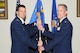GOODFELLOW AIR FORCE BASE, Texas -- Col. J. Kelly Klein, 17th Medical Group Commander, passes the 17th Medical Operations Squadron guidon to Lt. Col. Paul T. Miller, during a change of command ceremony at the Event Center here July 3. Miller assumed command of the 17th MDSS from Lt. Col. Regina D. Agee-Cruz. (U.S. Air Force photo/ Staff Sgt. Laura R. McFarlane)
