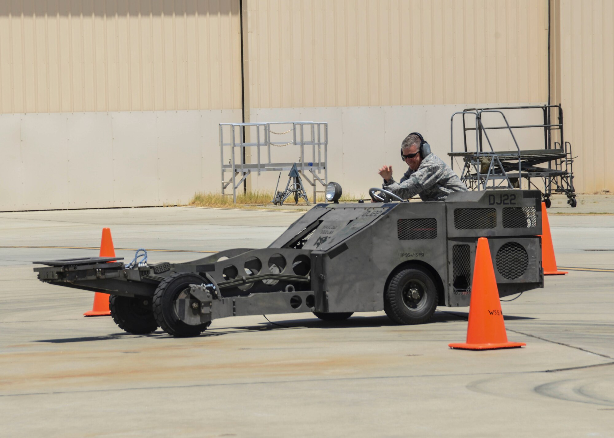 Col. Robby Weaver, 412th MXG commander kicks-off the Jammer Jamboree, which names the fastest driver in the MJ-1B munitions loader. The 2nd Quarter Weapons Load Competition was Weaver’s last competition before his retirement July 10. (U.S. Air Force photo by Rebecca Amber)