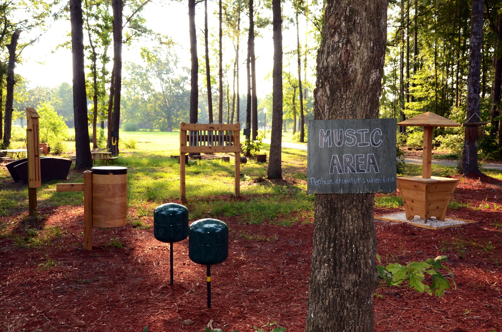 The Joint Base Charleston - Air Base Youth Programs recently enhanced
the current natural playground area at the youth center with the addition of
interactive and musical equipment for the children. The musical additions to
the play area include a pebble harp, sound tubes, thunder drum and steel
drums. The other improvements to the play area include a collection table
area where the children can sort, count, rearrange, make patterns, dig and
mix materials, as well as a natural seating area and ropes obstacle course.
(U.S. Air Force photo/Jessica Donnelly) 
