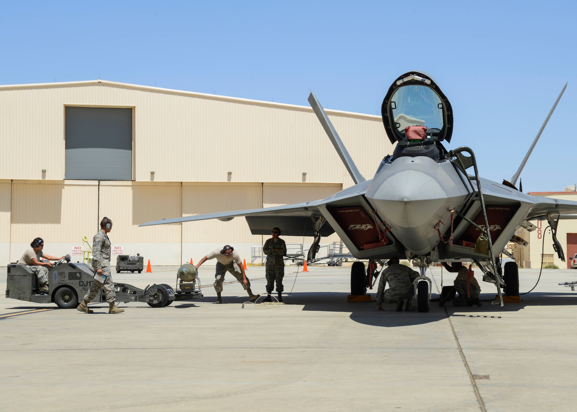 The 411th Aircraft Maintenance Unit team transports a GBU-32 to the F-22 Raptor’s Station 6. Competition evaluators watch closely, ensuring that each task is performed safely and according to technical data standards. (U.S. Air Force photo by Rebecca Amber)