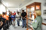 Capt. Christine Wagner (right), 99th Flying Training Squadron T-1A Jayhawk instructor pilot, explains her squadron’s Tuskegee heritage to youth from across the Central Texas region June 27 during a three-day tour at Joint Base San Antonio-Randolph.Photo by Melissa Peterson

