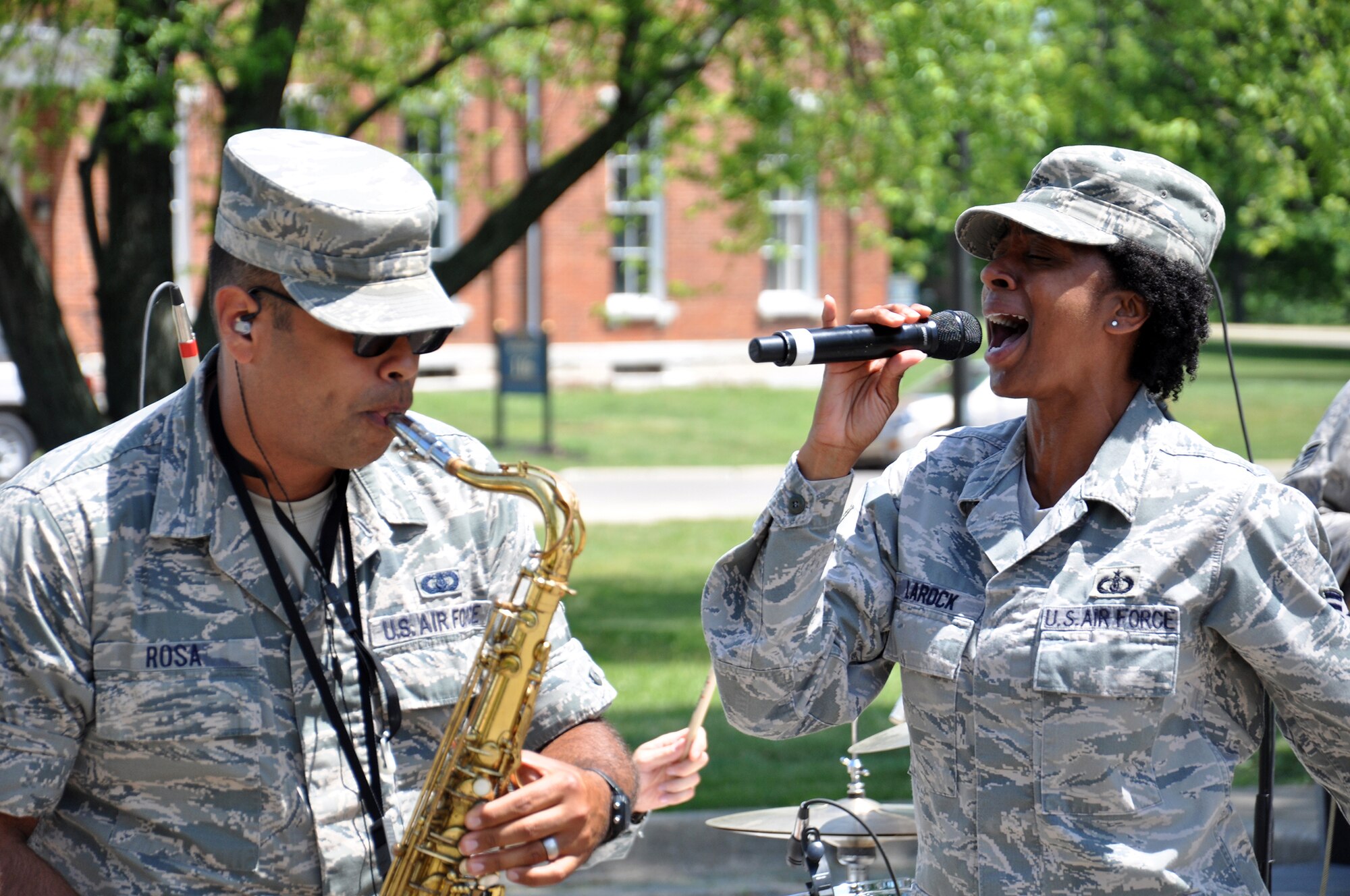 DAYTON, OHIO - Air Force Band of Flight’s “Systems Go” performers Senior Airman Luis Rosa, alto saxophone, and Tech. Sgt. Felita LaRock, vocalist, perform with their band for more than 250 residents and families of the Dayton Veterans Affairs Medical Center June 7. Members of the 88th Air Base Wing and 445th Airlift Wing gathered at the VA for food, fellowship and fun at the annual VAMC picnic, a mainstay since 1996 for VAMC residents. (U.S. Air Force photo/Tech. Sgt. Patrick O’Reilly)