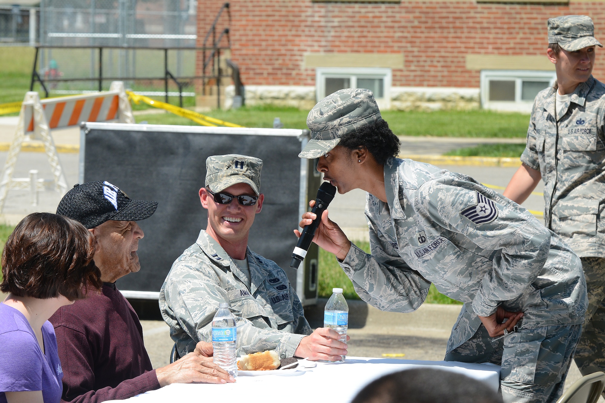 DAYTON, OHIO - Air Force Band of Flight’s “Systems Go” performer Tech. Sgt. Felita LaRock, vocalist, performs for more than 250 residents and families of the Dayton Veterans Affairs Medical Center June 7. Members of the 88th Air Base Wing and 445th Airlift Wing gathered at the VA for food, fellowship and fun at the annual VAMC picnic, a mainstay since 1996 for VAMC residents. (U.S. Air Force photo/Tech. Sgt. Frank Oliver)
