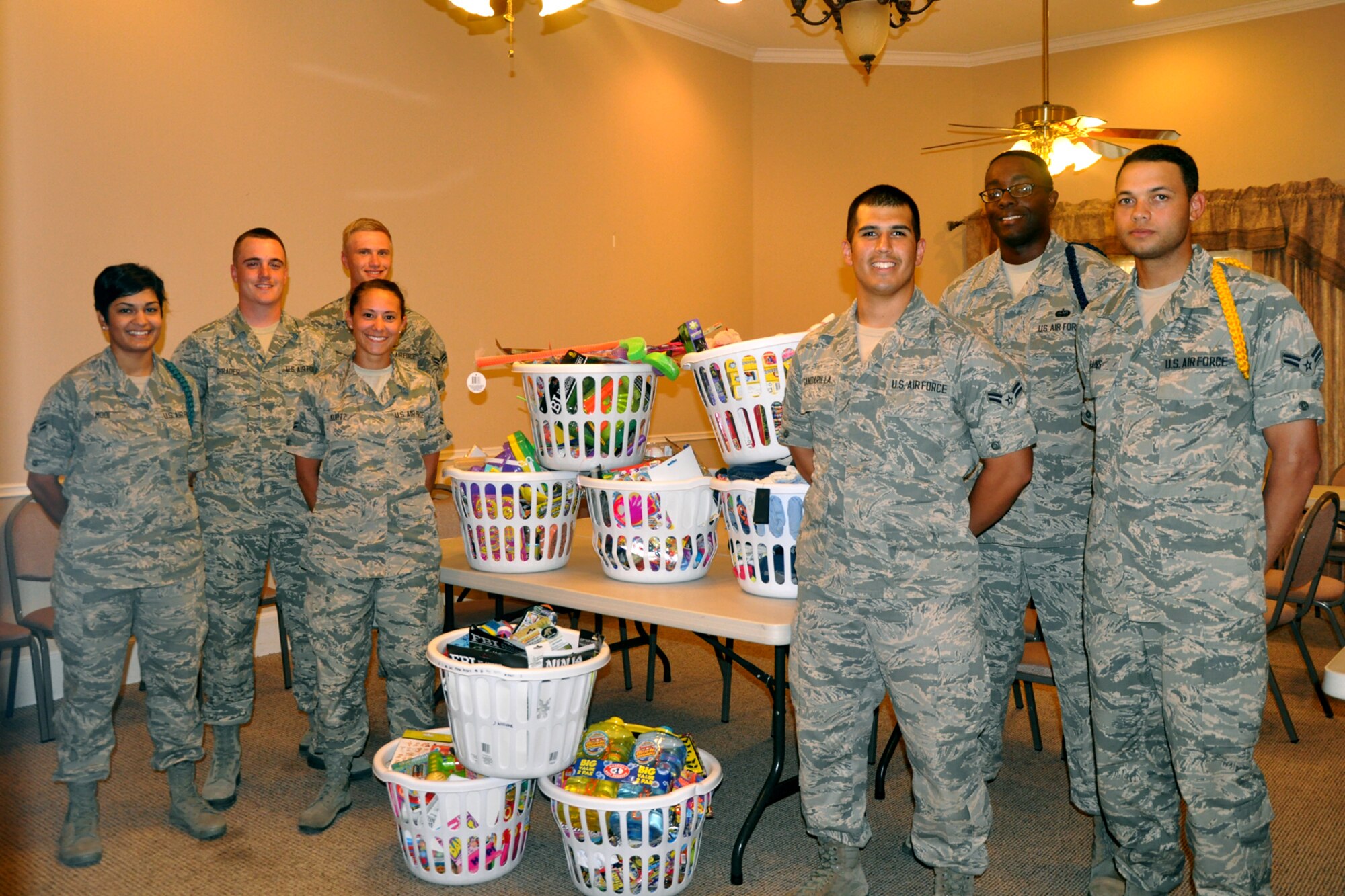 SAN ANGELO, Texas – Volunteers from the 315th Training Squadron stand with some of the donations collected at the Children’s Advocacy Center of Tom Green County after a donation drop-off July 1. This project began with a Students Against Sexual Harassment member acting as a CAC liaison to help donate items the advocacy center requests. (U.S. Air Force photo/ Airman 1st Class Breonna Veal)
