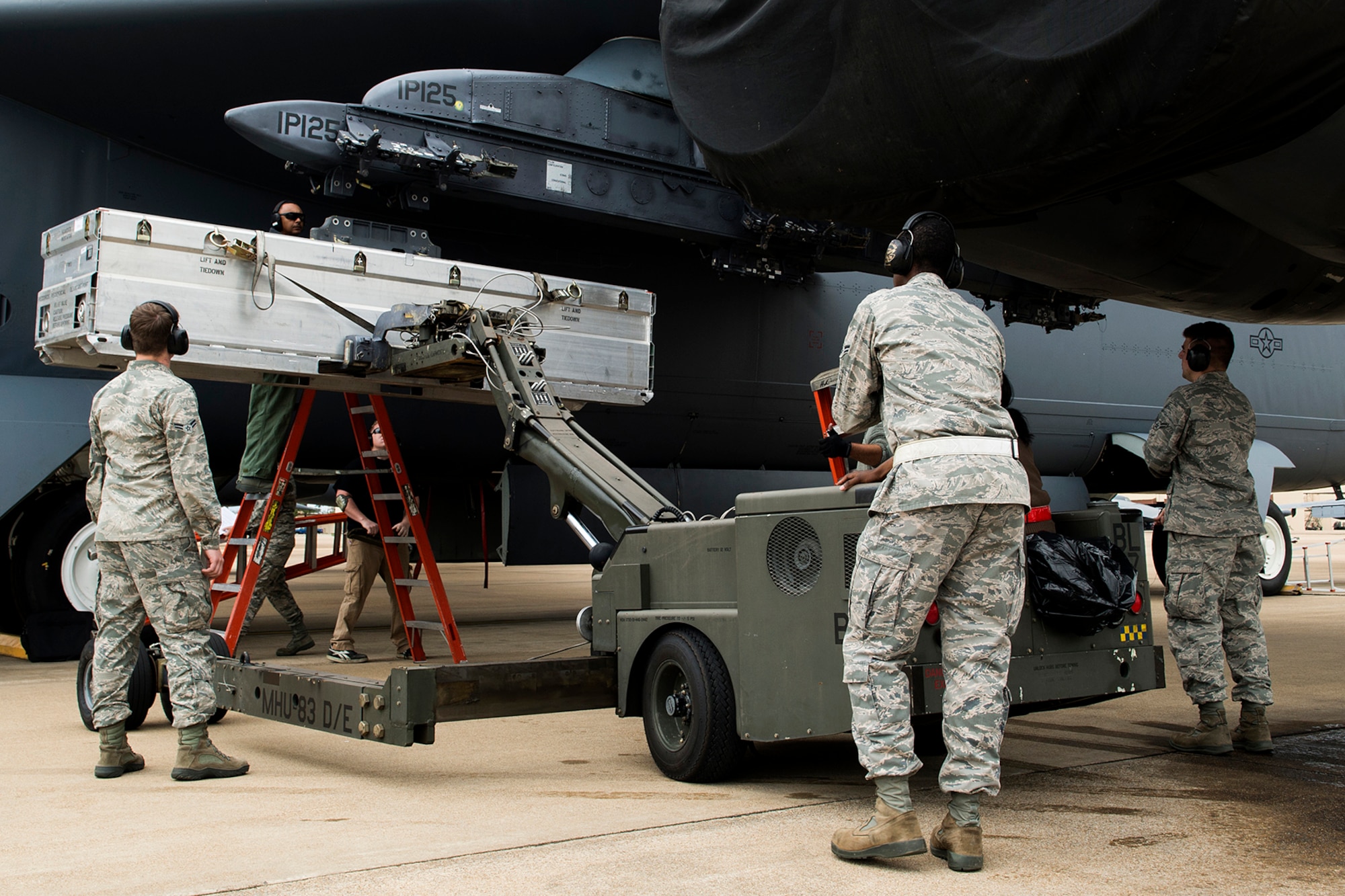 Weapons technicians assigned to the 307th and 2nd Aircraft Maintenance Squadrons install a simulated AN/ASQ-236 Radar Pod on a 93rd Bomb Squadron B-52H Stratofortress, April 7, 2014, Barksdale Air Force Base, La. The technicians practiced loading the simulated shape in preparations for loading the real pod for testing on the B-52. (U.S. Air Force photo by Master Sgt. Greg Steele/Released)