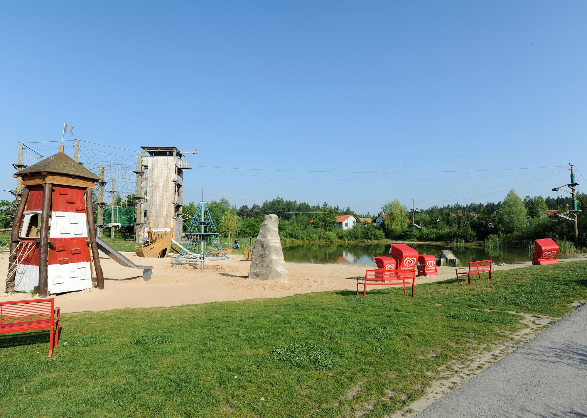 A small pond, climbing complex and zip lines sit in the middle of the Legoland Resort in Gunzburg, Germany. Off to the side of the pond is a small race track with a dozen bikes for kids to enjoy. (U.S. Air Force photo/Staff Sgt. R.J. Biermann)