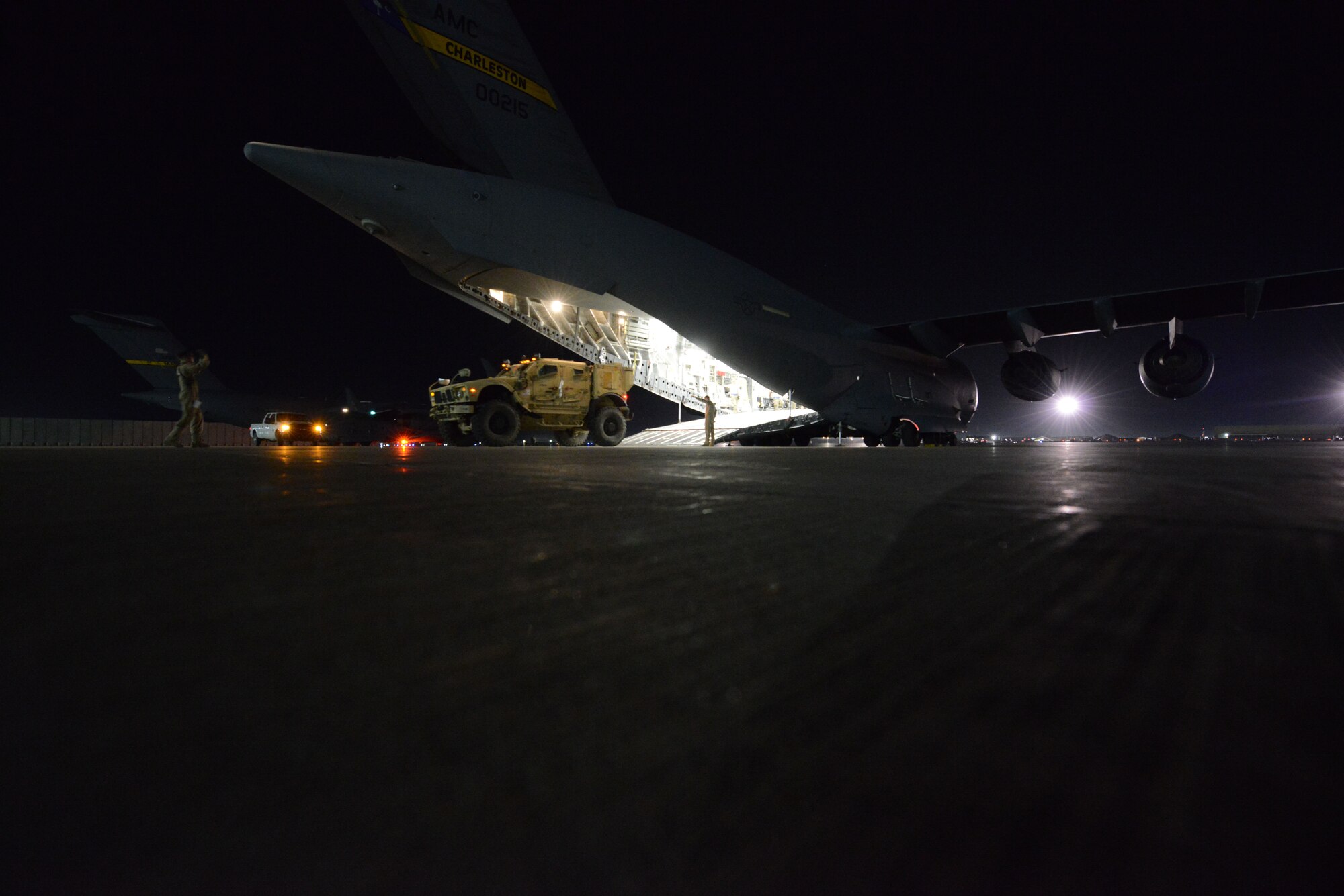 A Mine Resistant Ambush Protected vehicle is driven in reverse onto a C-17 Globemaster III at Bagram Airfield, Afghanistan in preparation for redeployment June 21, 2014. (U.S. Air Force photo by Master Sgt. Cohen A. Young/Released)  