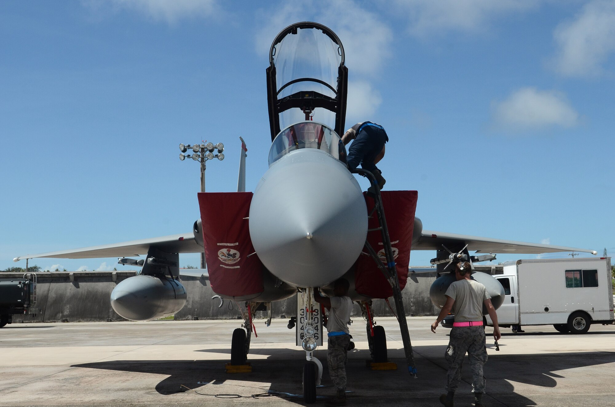 Airmen of the 44th Aircraft Maintenance Unit assigned to Kadena Air Base, Japan inspect an F-15C Eagle after a training mission June 27, 2014, on Andersen Air Force Base, Guam. The Airmen, aircraft and equipment came to Andersen to take part in an aviation training relocation program, which is an opportunity for Kadena Airmen to improve their skillsets in a location with less noise restrictions. (U.S. Air Force photo by Airman 1st Class Emily A. Bradley/Released)