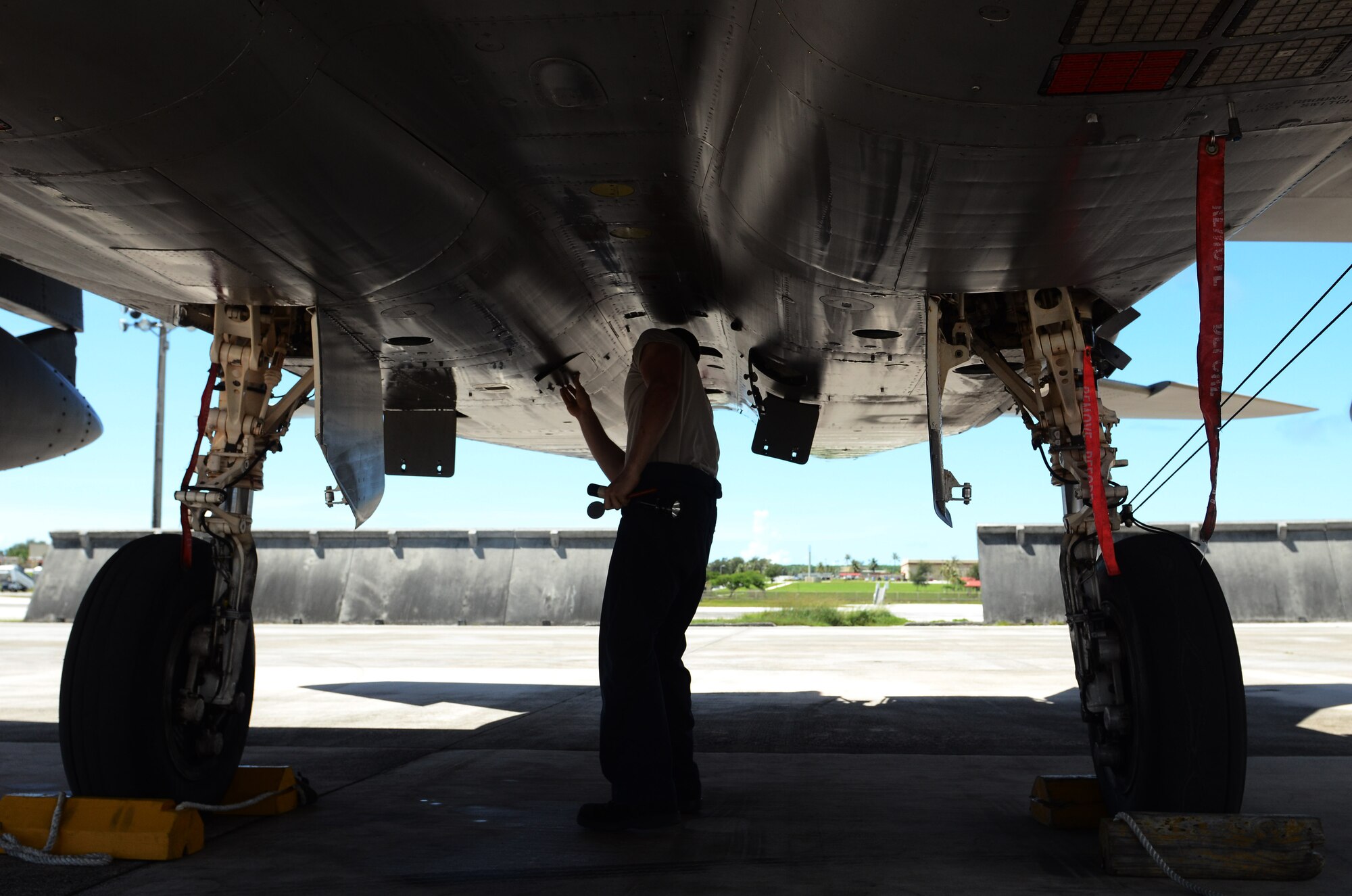 Airman 1st Class Nicholas Spitzkopf, 44th Aircraft Maintenance Unit crew chief, inspects an F-15C Eagle, June 27, 2014, on Andersen Air Force Base, Guam. Kadena Airmen assigned to Kadena Air Base, Japan came to Guam to practice their operational skillsets in a location with less noise restrictions. (U.S. Air Force photo by Airman 1st Class Emily A. Bradley/Released)