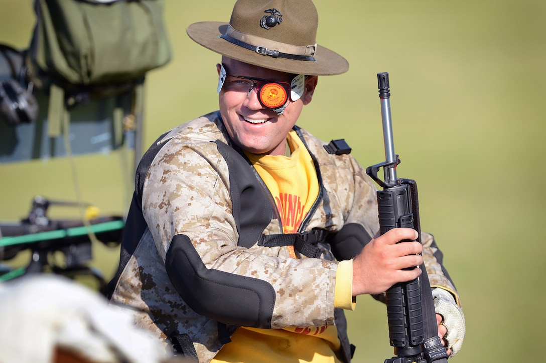 Marine Corps Sgt. Kyle Bailey smiles as he prepares to take his turn during the 2014 Interservice Rifle Competition on Quantico Marine Base, Va., July 8, 2014. Bailey is a marksman with the U.S. Marine Corps Shooting Team.