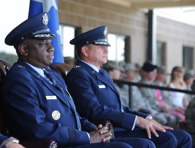Brig. Gen. Mark Brown, incoming 2nd Air Force commander, and Maj. Gen. Leonard Patrick, outgoing commander, watch the troops as they prepare to march during pass and review following the 2nd Air Force change of command ceremony July 3, 2014, at Keesler Air Force Base, Miss.  Brown was previously the Financial Management director, Headquarters Air Force Material Command at Wright-Patterson Air Force Base, Ohio. Patrick is headed to Randolph Air Force Base, Texas, where he will become the AETC vice commander.  (U.S. Air Force photo by Kemberly Groue)