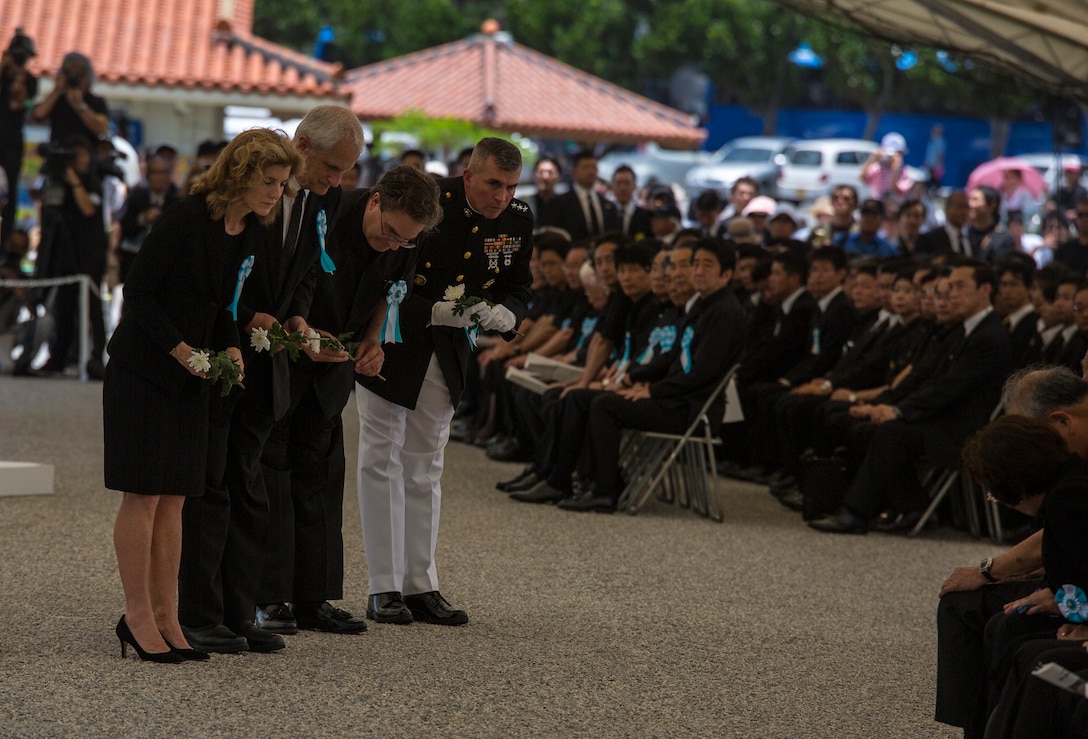 From left to right, Caroline B. Kennedy, Edwin Schlossberg, Alfred R. Magleby and Lt. Gen. John Wissler greet distinguished guests while participating in a memorial ceremony June 23 at the Okinawa Peace Memorial Park in Itoman, Okinawa, Japan. Distinguished guests in attendance included Hirokazu Nakaima, the governor of Okinawa, and Shinzo Abe, the prime minister of Japan. The memorial service fostered the ongoing positive relationship between the two nations. Kennedy is the U.S. ambassador to Japan and daughter of the 35th president of the U.S., John F. Kennedy. Schlossberg is an author and husband of Kennedy. Magleby is the U.S. consul general, Naha. Wissler is the commanding general of III Marine Expeditionary Force. (U.S. Marine Corps photo by Lance Cpl. Joey S. Holeman, Jr./Released)