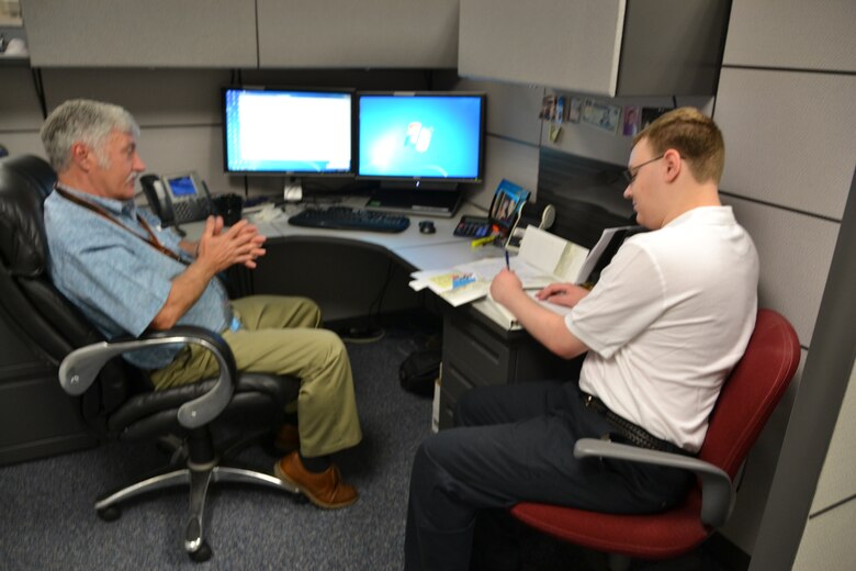 Employee Stephan Hake speaks with Will Heuser during the STEM shadowing experience