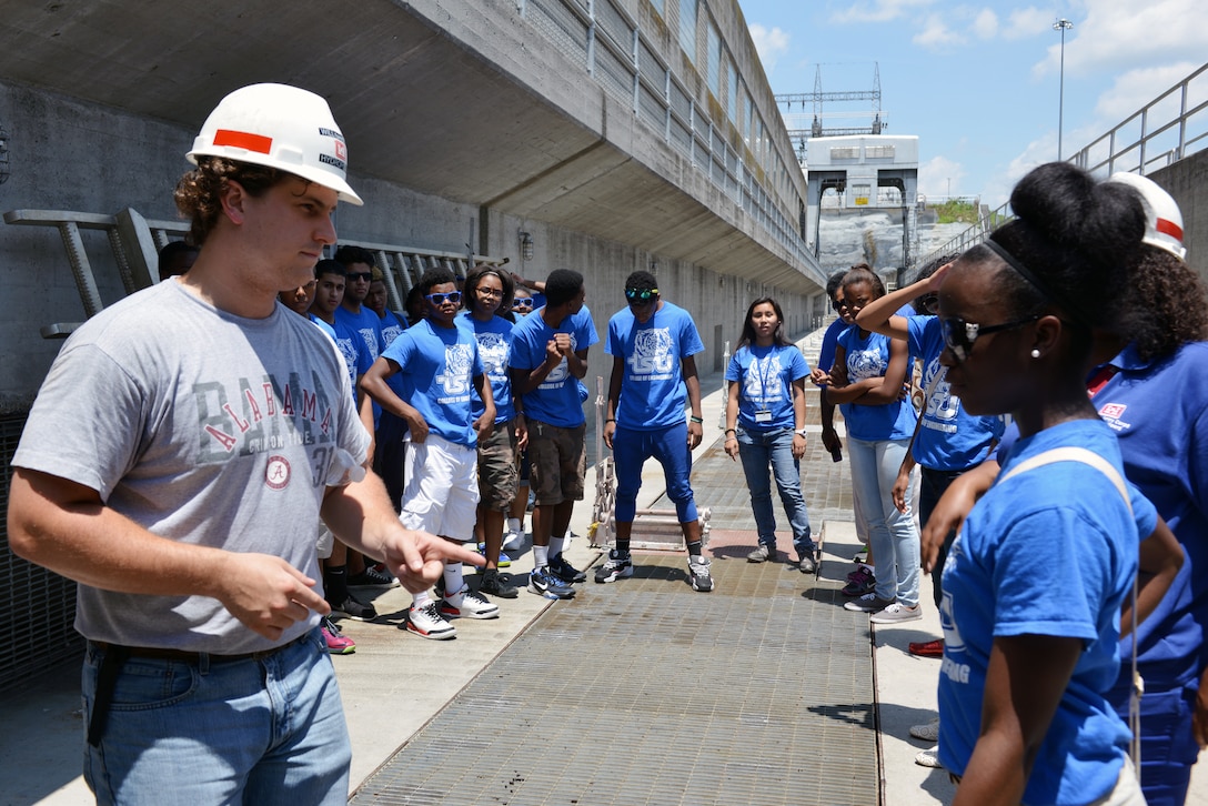 Will Garner, an Old Hickory Hydropower trainee at the Old Hickory Lock and Dam from the Nashville District provides students from the National Summer Transportation Institute program with information about the operations of the Old Hickory Lock and Dam on June 30, 2014. 