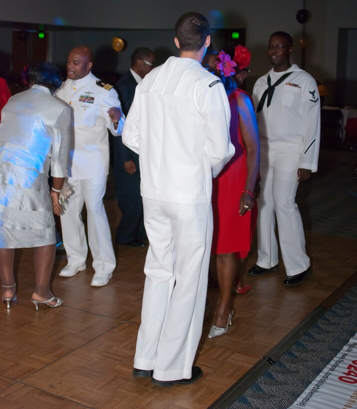 Sailors dance with attendees during the Senior Prom June 20 at the Albany James H. Gray Sr. Civic Center in Albany, Georgia.
