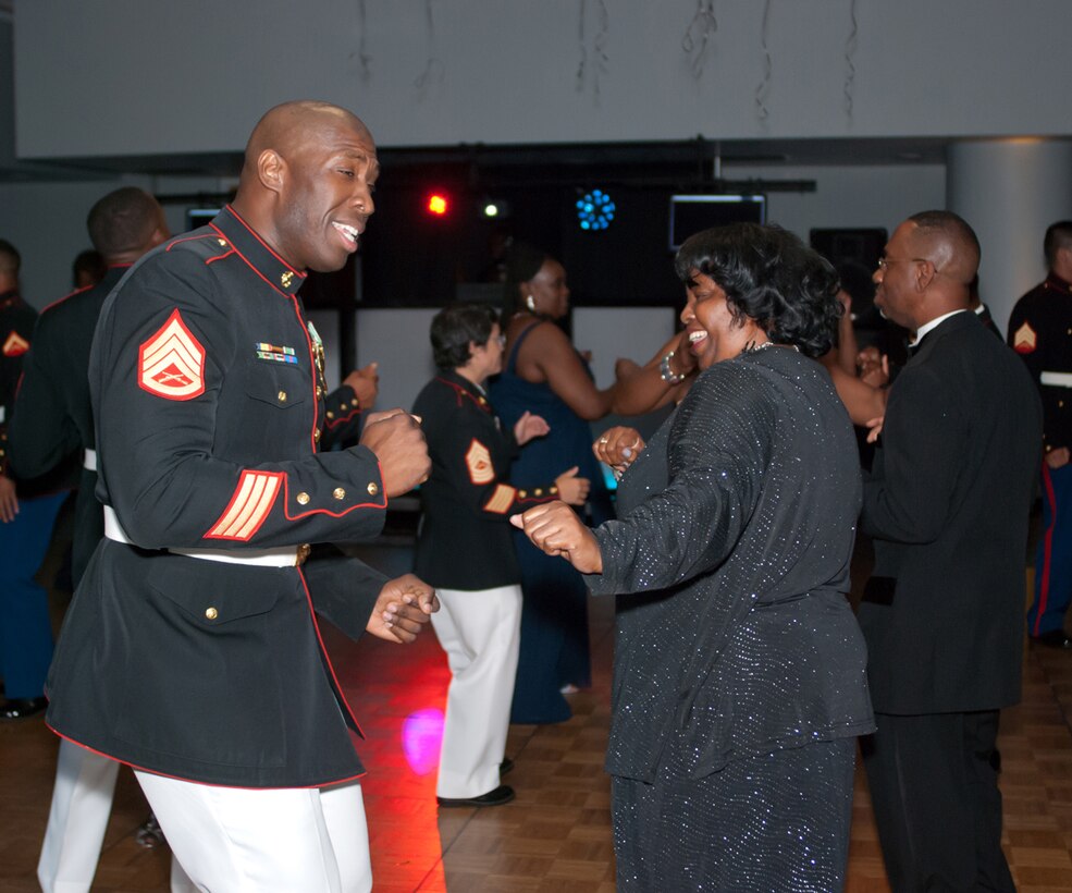 Then-Staff Sgt. Tony Robinson, inventory management assistant, Weapons Systems Management Center, Marine Corps Logistics Command, dances with an attendee during the 12th annual Senior Prom at the Albany James H. Gray Sr. Civic Center in Albany Georgia, June 20.