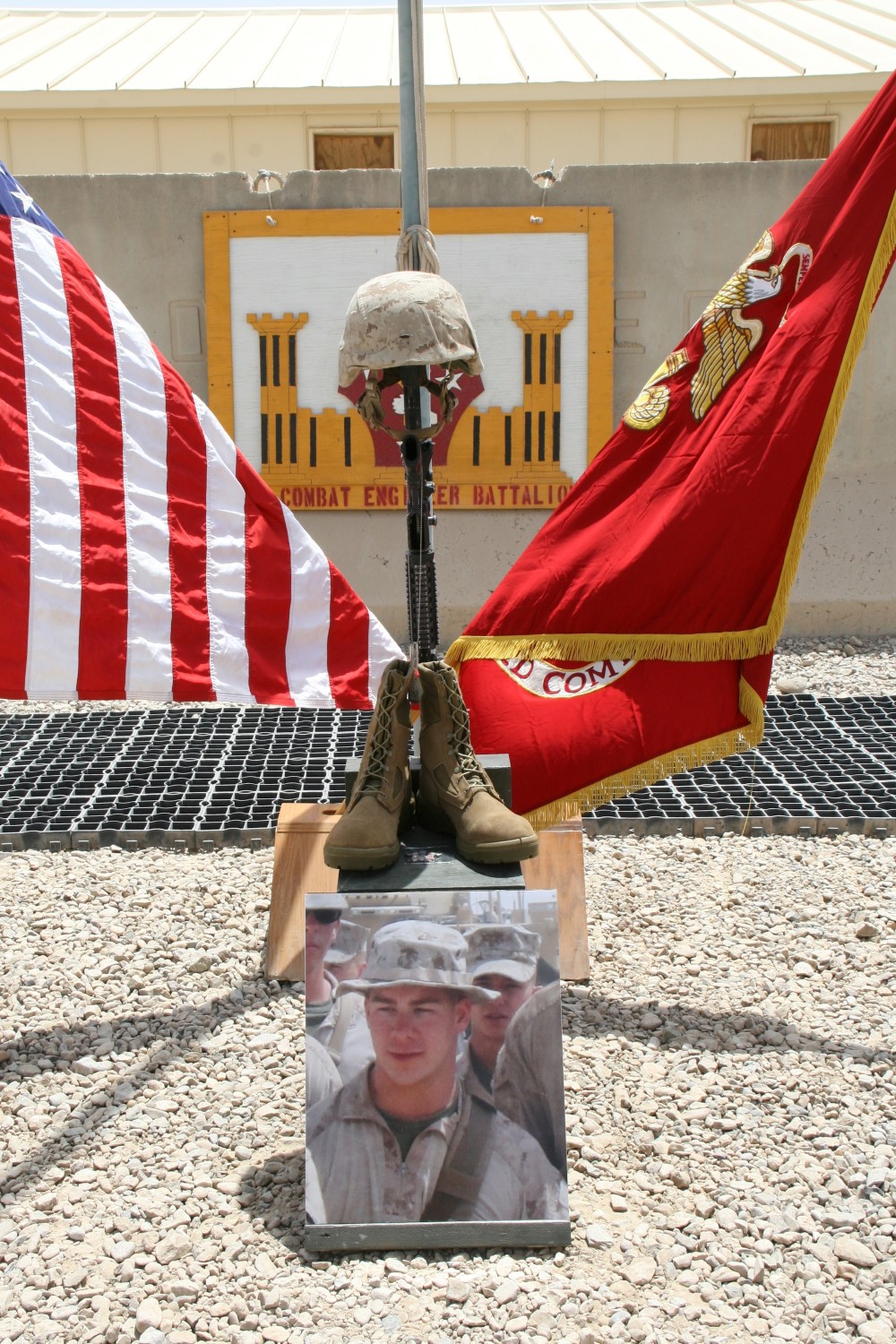 A  battlefield cross stands in honor of Cpl. Brandon J. Garabrant, combat engineer, 3rd Platoon, Route Clearance Company, 2nd Combat Engineer Battalion, and native of Peterborough, New Hampshire, during a memorial ceremony aboard Camp Leatherneck, Afghanistan, July 8, 2014. Garabrant was killed while conducting combat operations in Helmand province, June 20, 2014.