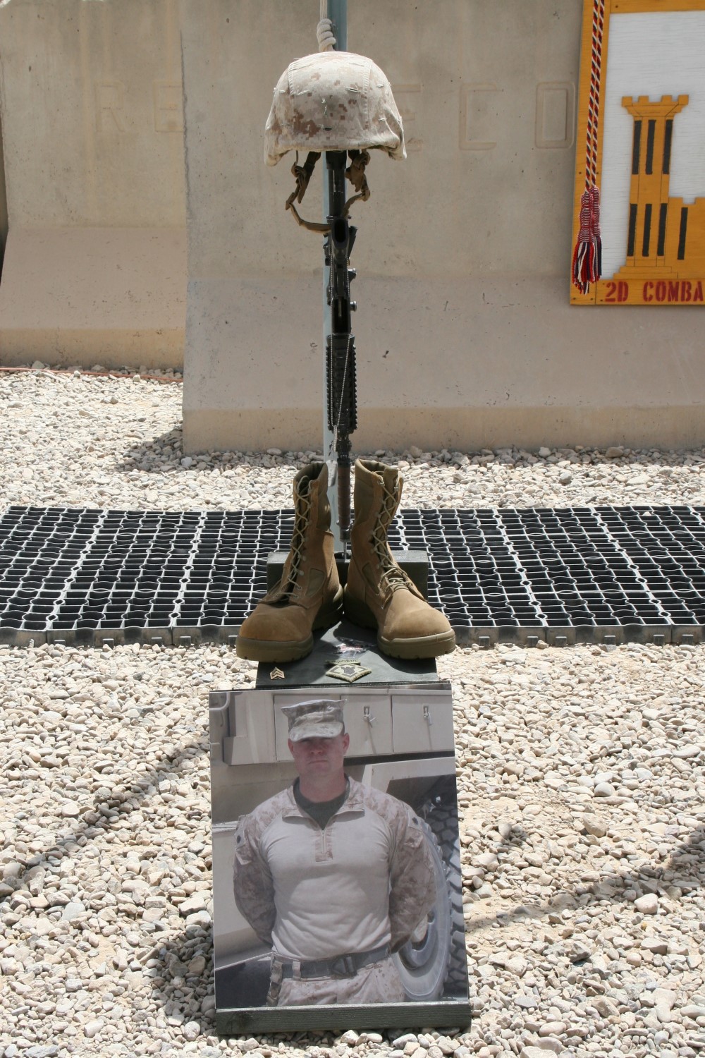 A  battlefield cross stands in honor of Staff Sgt. David H. Stewart, combat engineer, platoon sergeant, 3rd Platoon, Route Clearance Company, 2nd Combat Engineer Battalion, and native of Stafford, Virginia, during a memorial ceremony aboard Camp Leatherneck, Afghanistan, July 8, 2014. Stewart was killed while conducting combat operations in Helmand province, June 20, 2014.