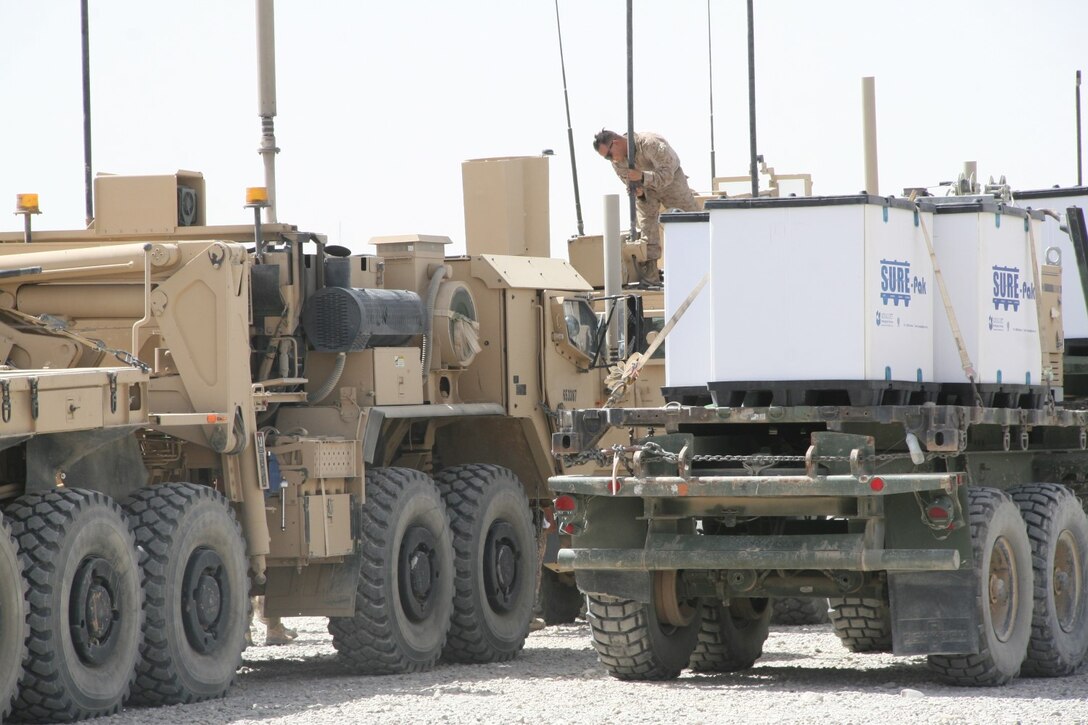 A Marine with Redeployment and Retrograde in support of Reset and Reconstitution Operations Group secures equipment to tactical vehicles aboard Camp Leatherneck, Helmand province, Afghanistan, July 1, 2014. R4OG was established during April 2012 and has a significant role as the unit responsible for bringing all Marine Corps gear home from Afghanistan.