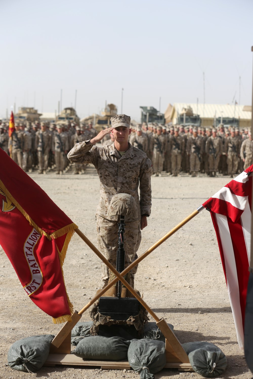 Corporal Matthew Kearney, professionally instructed gunman, Scout Sniper Platoon, 1st Battalion, 7th Marine Regiment, and a native of Stafford, Virginia, salutes a battlefield cross during a memorial ceremony aboard Camp Leatherneck, July 2, 2014. The memorial was in honor of Sgt. Thomas Z. Spitzer, a professionally instructed gunman with Scout Sniper Platoon, 1st Bn., 7th Marines, who was killed while conducting combat operations in Helmand province, Afghanistan, June 25, 2014.
(U.S. Marine Corps photo by Cpl. Joseph Scanlan / released)
