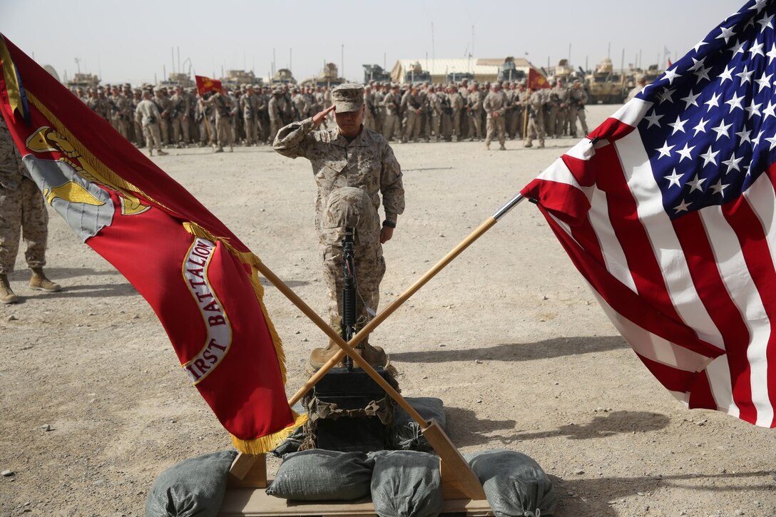 Brigadier Gen. Daniel D. Yoo, commander of Regional Command (Southwest), salutes a battlefield cross during a memorial ceremony aboard Camp Leatherneck, July 2, 2014. The memorial was in honor of Sgt. Thomas Z. Spitzer, a professionally instructed gunman with Scout Sniper Platoon, 1st Battalion, 7th Marine Regiment, who was killed while conducting combat operations in Helmand province, Afghanistan, June 25, 2014.
(U.S. Marine Corps photo by Cpl. Joseph Scanlan / released)