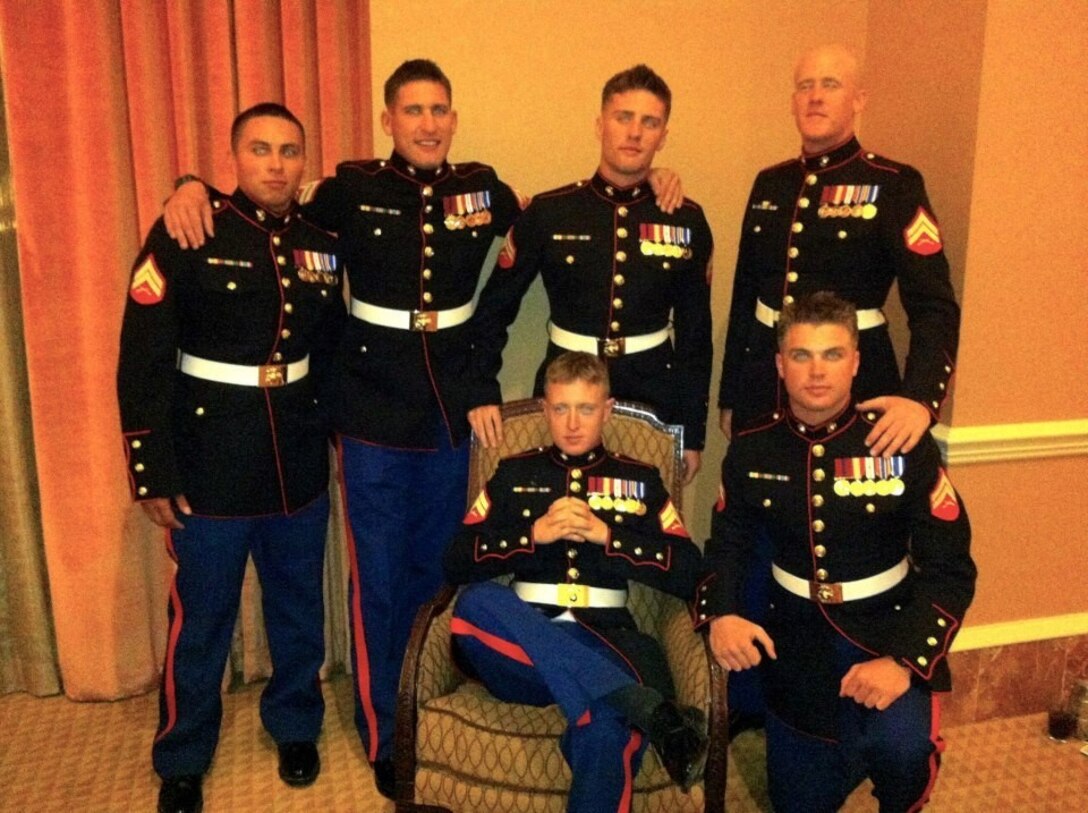 Then Corporal Thomas Z. Spitzer, right kneeling, professionally instructed gunman, Scout Sniper Platoon, 1st Battalion, 7th Marine Regiment, poses for a photo during the 2013 Marine Corps Birthday Ball. Spitzer, a 23-year-old native of New Braunfels, Texas, was killed while conducting combat operations in Helmand province, Afghanistan, June 25, 2014.