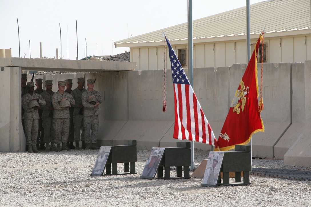 Marines with 2nd Combat Engineer Battalion stand ready with combat boots, rifles and Kevlar helmets to build the battlefield crosses in honor of three fallen Marines during a memorial ceremony aboard Camp Leatherneck, Afghanistan, July 8, 2014. The service was held to honor Staff Sgt. David H. Stewart, a combat engineer, platoon sergeant and native of Stafford, Virginia; Cpl. Brandon J. Garabrant, a combat engineer and native of Peterborough, New Hampshire; and Cpl. Adam F. Wolff, a combat engineer and native of Cedar Rapids, Iowa, all Marines serving with 3rd Platoon, Route Clearance Company, 2nd Combat Engineer Battalion, who gave the ultimate sacrifice while conducting combat operations in Helmand province, Afghanistan, June 20, 2014.