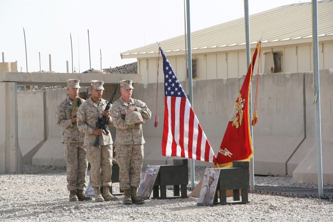 Marines with 2nd Combat Engineer Battalion carry combat boots, a rifle and Kevlar helmet to build the battlefield cross in honor of three fallen Marines during a memorial ceremony aboard Camp Leatherneck, Afghanistan, July 8, 2014. The service was held to honor Staff Sgt. David H. Stewart, a combat engineer, platoon sergeant and native of Stafford, Virginia; Cpl. Brandon J. Garabrant, a combat engineer and native of Peterborough, New Hampshire; and Cpl. Adam F. Wolff, a combat engineer and native of Cedar Rapids, Iowa, all Marines serving with 3rd Platoon, Route Clearance Company, 2nd Combat Engineer Battalion, who gave the ultimate sacrifice while conducting combat operations in Helmand province, Afghanistan, June 20, 2014.