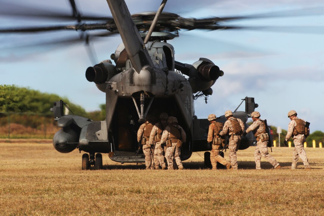 U.S. Marines with 3rd Battalion, 3rd Marine Regiment, board a CH-53E Super Stallion for a fast-roping exercise during Ground Air Integration Training June 30. GAIT allows militaries to insert troops onto the ground by a helicopter quickly without having to land the aircraft. Twenty-two nations, more than 40 ships and submarines, more than 200 aircraft and 25,000 personnel are participating in RIMPAC exercise from June 26 to Aug. 1, in and around the Hawaiian Islands. The world's largest international maritime exercise, RIMPAC provides a unique training opportunity that helps participants foster and sustain the cooperative relationships that are critical to ensuring the safety of sea lanes and security on the world's oceans. RIMPAC 2014 is the 24th exercise in the series that began in 1971.  