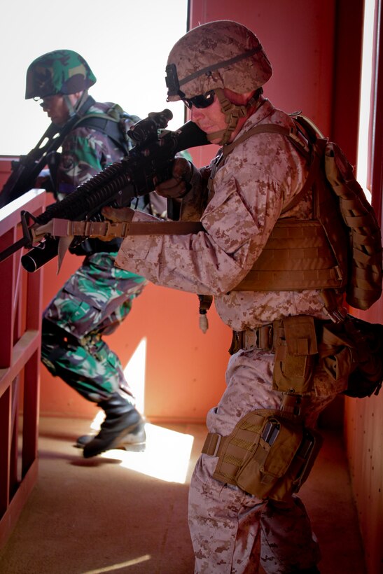 U.S. Marines and Indonesian Marines clear a simulated enemy occupied building during Military Operations in Urban Terrain (MOUT) training at Marine Corps Base Hawaii, Kaneohe Bay, July 3, 2014 as part of the Rim of the Pacific 2014 (RIMPAC) Exercise. This year marks the 24th exercise in the series that began in 1971. The exercise is hosted by Commander, U.S. Pacific Fleet, in and around the islands of Hawaii. RIMPAC 2014 takes place from June 26 to Aug. 1, and includes events in port as well as underway. (U.S. Marine Corps photo by Sgt. William L. Holdaway//RELEASED)