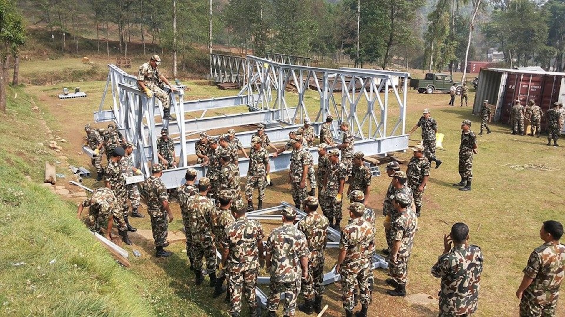 FORT BELVOIR, Va (July 9, 2014) - Soldiers from the Nepalese Army assemble one of four Acrow roadway bridges that were recently delivered to Nepal as part of a foreign military sales, coordinated by the U.S. Army Security Assistance Command. The modular bridge system will be used for future humanitarian assistance and disaster relief.  (Courtesy photo by U.S. Army) 