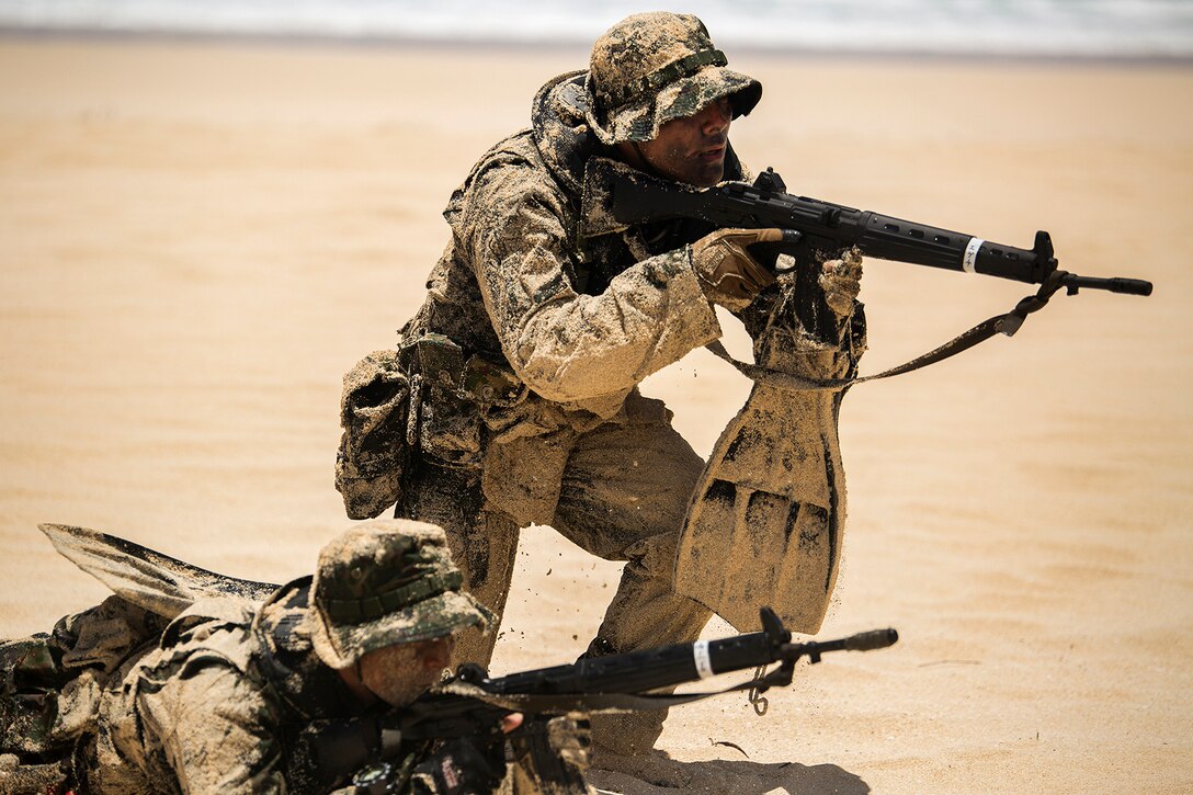 Soldiers with the Japan Ground Self-Defense Force(JGSDF) advance positions on the beach during an amphibious assault at Pyramid Rock Beach. The JGSDF conducted the training exercise with U.S. Marines with 3rd Reconnaissance Battalion, based in Okinawa, Japan. The world's largest international maritime exercise, Rim of the Pacific (RIMPAC) Exercise 2014, provides a unique training opportunity that helps participants foster and sustain the cooperative relationships that are critical to ensuring the safety of sea lanes and security on the world's oceans. Twenty-two nations, more than 40 ships, six submarines, more than 200 aircraft and 25,000 personnel are participating in RIMPAC.