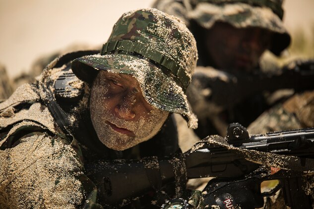 A soldier with the Japan Ground Self-Defense Force (JGSDF) waits for his squad leader to give the signal to advance positions during an amphibious assault at Pyramid Rock Beach. The JGSDF conducted the training exercise with U.S. Marines with 3rd Reconnaissance Battalion, based in Okinawa, Japan. The world's largest international maritime exercise, Rim of the Pacific (RIMPAC) Exercise 2014, provides a unique training opportunity that helps participants foster and sustain the cooperative relationships that are critical to ensuring the safety of sea lanes and security on the world's oceans. Twenty-two nations, more than 40 ships, six submarines, more than 200 aircraft and 25,000 personnel are participating in RIMPAC.
