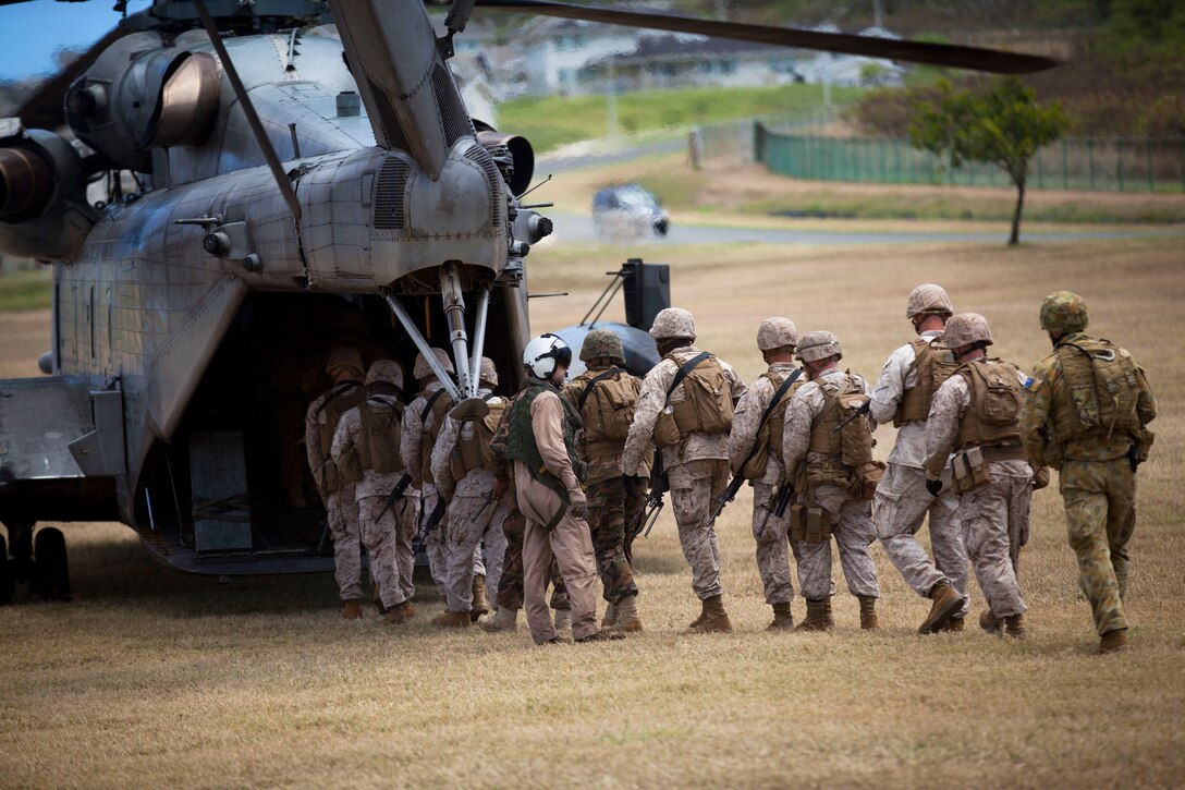 Marines with the Royal Australian Regiment intergrate with U.S. Marines as they board a CH-53E Super Stallion during helo insertion and extraction training for Rim of the Pacific (RIMPAC) Exercise 2014 at Landing Zone Eagle. Twenty-two nations, more than 40 ships and submarines, about 200 aircraft and 25,000 personnel are participating in RIMPAC from June 26 to August 1, in and around the Hawaiian Islands and Southern California. The world's largest international maritime exercise, RIMPAC provides a unique training opportunity that helps participants foster and sustain the cooperative relationships that are critical to ensuring the safety of sea lanes and security on the world's oceans. RIMPAC 2014 is the 24th exercise in the series that began in 1971.