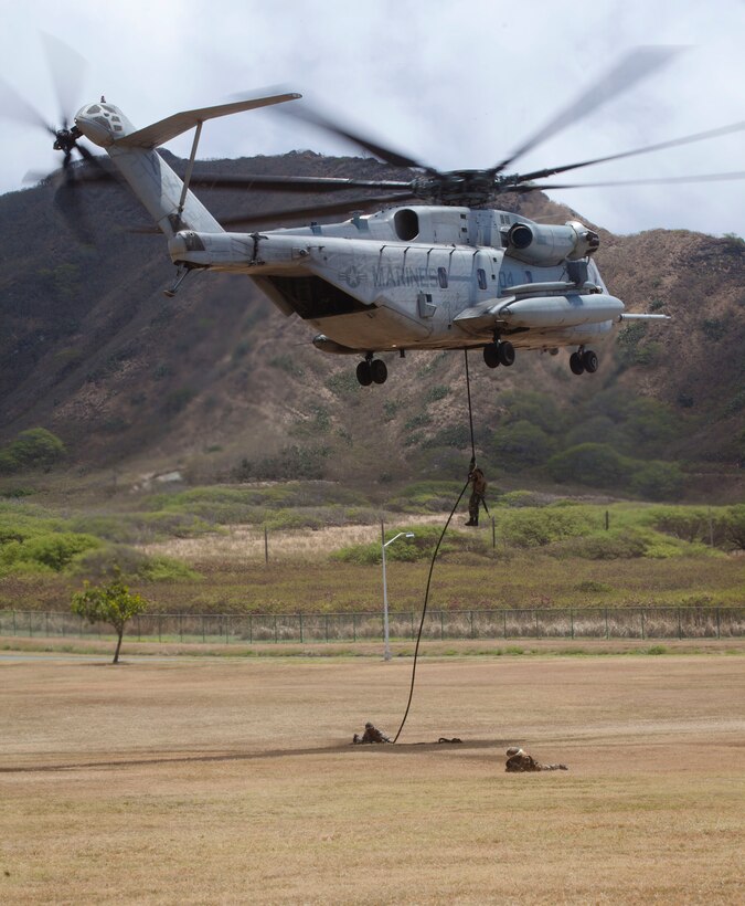 Malaysian Soldiers fast rope from a CH-53E Super Stallion during Rim of the Pacific (RIMPAC) Exercise 2014 at Landing Zone Eagle. Twenty-two nations, 49 ships, 6 submarines, more than 200 aircraft and 25,000 personnel are participating in RIMPAC from June 26 to Aug. 1, in and around the Hawaiian Islands and Southern California. The world's largest international maritime exercise, RIMPAC provides a unique training opportunity that helps participants foster and sustain the cooperative relationships that are critical to ensuring the safety of sea lanes and security on the world's oceans. RIMPAC 2014 is the 24th exercise in the series that began in 1971.