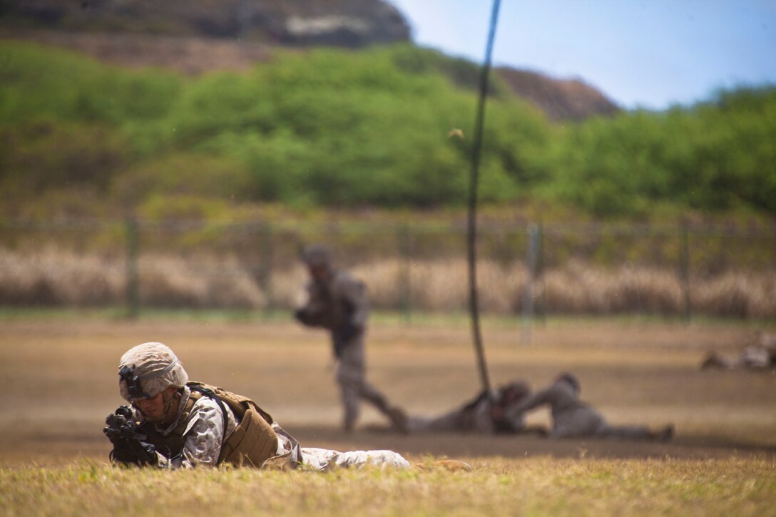 U.S. Marine Corps Cpl. Byung Kim, a cannoneer with Charlie Battery, 1st Battalion, 12th Marine Regiment, helps provide 360 security while Marines fast rope off a CH-53E Super Stallion during Rim of the Pacific Exercise 2014 July 02, 2014, at Landing Zone Eagle. Twenty-two nations, 49 ships, 6 submarines, more than 200 aircraft and 25,000 personnel are participating in RIMPAC from June 26 to Aug. 1, in and around the Hawaiian Islands and Southern California. The world's largest international maritime exercise, RIMPAC provides a unique training opportunity that helps participants foster and sustain the cooperative relationships that are critical to ensuring the safety of sea lanes and security on the world's oceans. RIMPAC 2014 is the 24th exercise in the series that began in 1971.