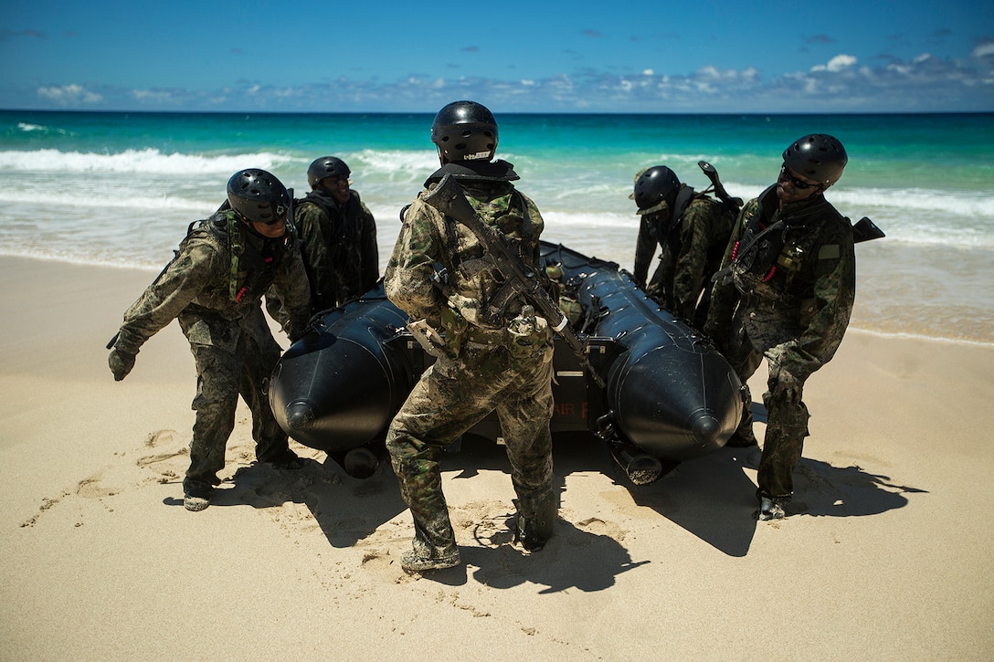 Japan Ground Self-Defense Force soldiers anchor their amphibious warfare vessel on Pyramid Rock Beach during an amphibious assault July 01, 2014. The JGSDF conducted the training exercise with U.S. Marines with 3rd Reconnaissance Battalion, based in Okinawa, Japan. The world's largest international maritime exercise, Rim of the Pacific Exercise 2014, provides a unique training opportunity that helps participants foster and sustain the cooperative relationships that are critical to ensuring the safety of sea lanes and security on the world's oceans. Twenty-two nations, more than 40 ships, six submarines, more than 200 aircraft and 25,000 personnel are participating in RIMPAC.