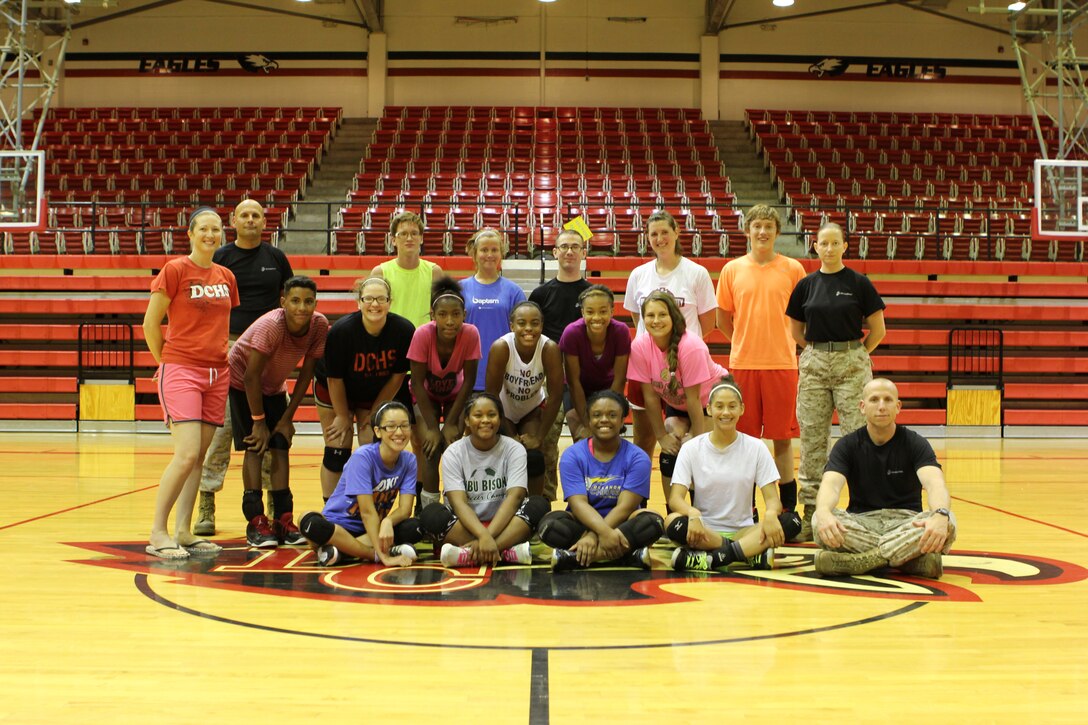 Student athletes and coaches from Del City High School in Del City, Okla.
pose for a photo with Marines from Recruiting Station Oklahoma City
following a leadership seminar and physical fitness challenge July 9. The
majority of the student athletes were members of the Women's Varsity
Volleyball team at Del City High School. (U.S. Marine Corps Photo By Sgt.
Lucas Vega)
